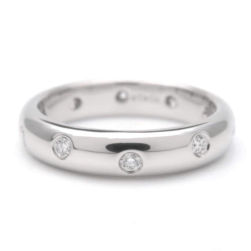TIFFANY & Co. Etoile Platinum Diamond 4mm Band Ring 5.5

Metal: Platinum
Size: 5.5 
Band Width: 4mm
Weight: 7.0 grams 
Diamond: 10 round brilliant diamonds, carat total weight .22
Hallmark: ©T&Co. PT950
Condition: Excellent condition, like new,