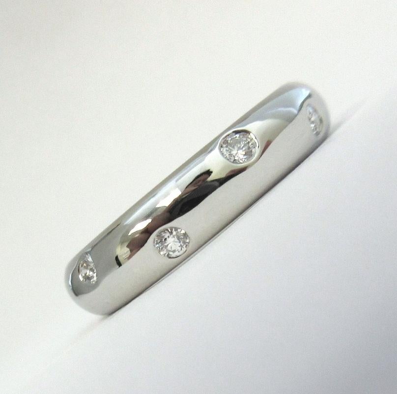 TIFFANY & Co. Platinum Diamond Etoile 4mm Band Ring 6

 Metal: Platinum
 Size: 6 
 Band Width: 4mm
 Weight: 7.50 grams 
 Diamond: 10 round brilliant diamonds, carat total weight .22
 Hallmark: T&Co. PT950
 Condition: Excellent condition, like new
