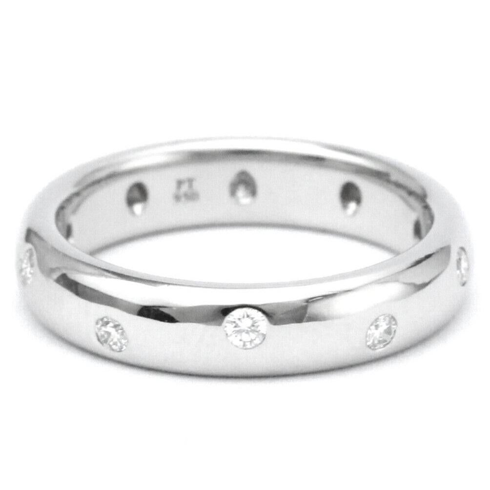 TIFFANY & Co. Etoile Platinum Diamond 4mm Band Ring 6 

Metal: Platinum
Size: 6 
Band Width: 4mm
Weight: 8.70 grams 
Diamond: 10 round brilliant diamonds, carat total weight .22
Hallmark: ©T&Co. PT950
Condition: Excellent condition, like new, comes