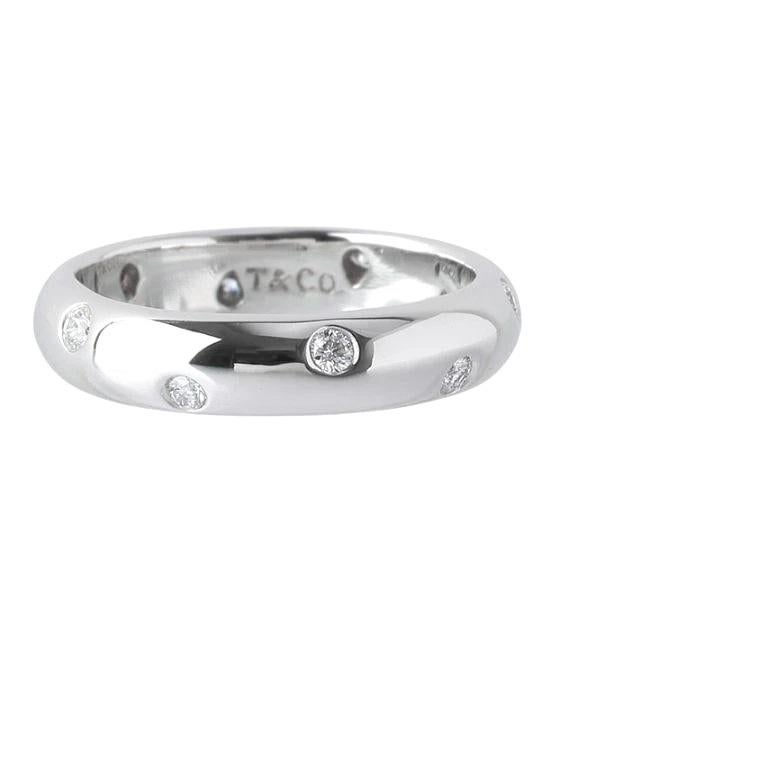 TIFFANY & Co. Etoile Platinum Diamond 4mm Band Ring 6

 Metal: Platinum
 Size: 6 
 Band Width: 4mm
 Weight: 6.80 grams 
 Diamond: 10 round brilliant diamonds, carat total weight .22
 Hallmark: T&Co. PT950
 Condition: Excellent condition, like new
