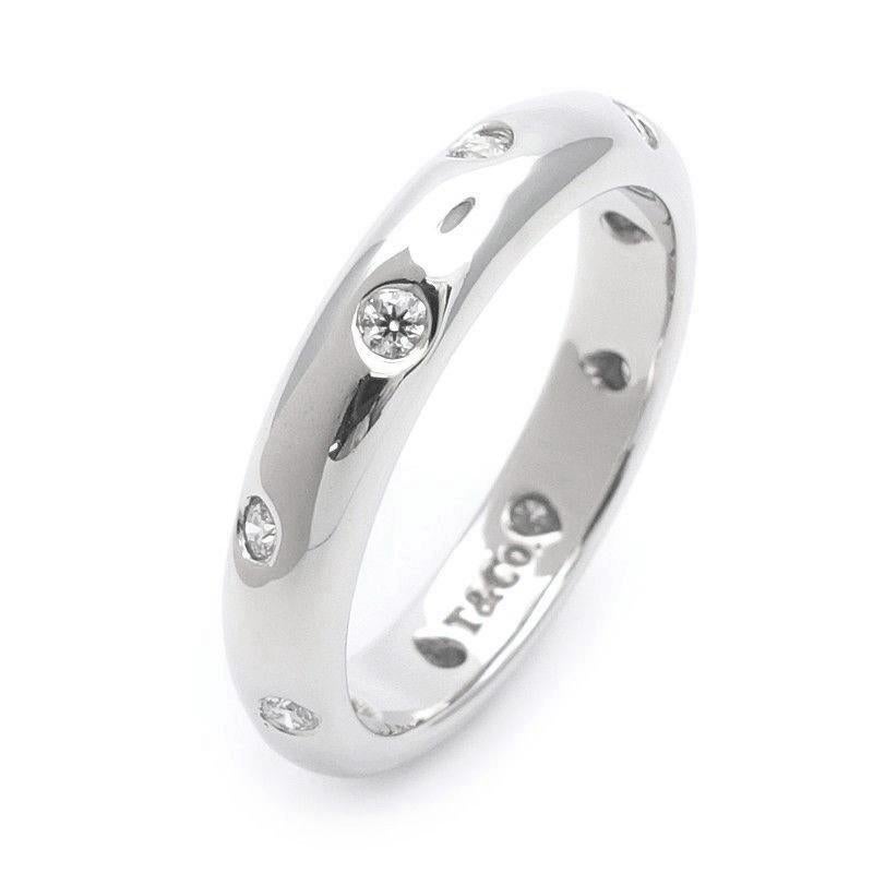 TIFFANY & Co. Etoile Platinum Diamond 4mm Band Ring 7

 Metal: Platinum
 Size: 7 
 Band Width: 4mm
 Weight: 7.90 grams 
 Diamond: 10 round brilliant diamonds, carat total weight .22
 Hallmark: T&Co. PT950
 Condition: Excellent condition, comes with