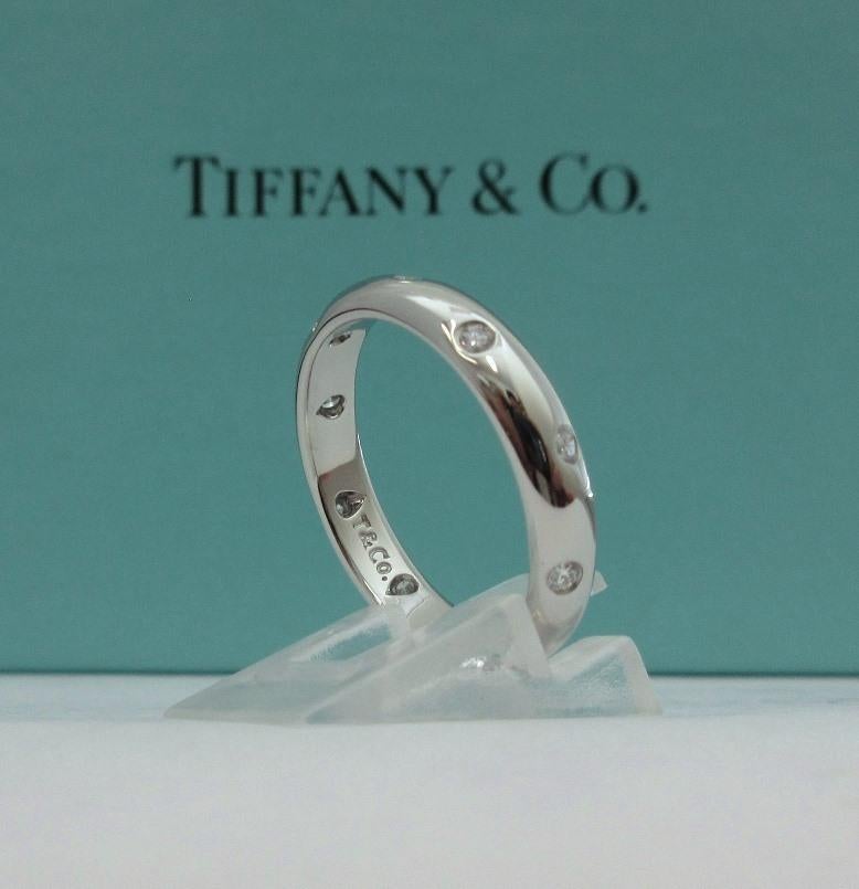 TIFFANY & Co. Platinum Diamond Etoile 4mm Band Ring 9

 Metal: Platinum
 Size: 9 
 Band Width: 4mm
 Weight: 8.10 grams 
 Diamond: 10 round brilliant diamonds, carat total weight .22
 Hallmark: T&Co. PT950
 Condition: Excellent condition, like new,