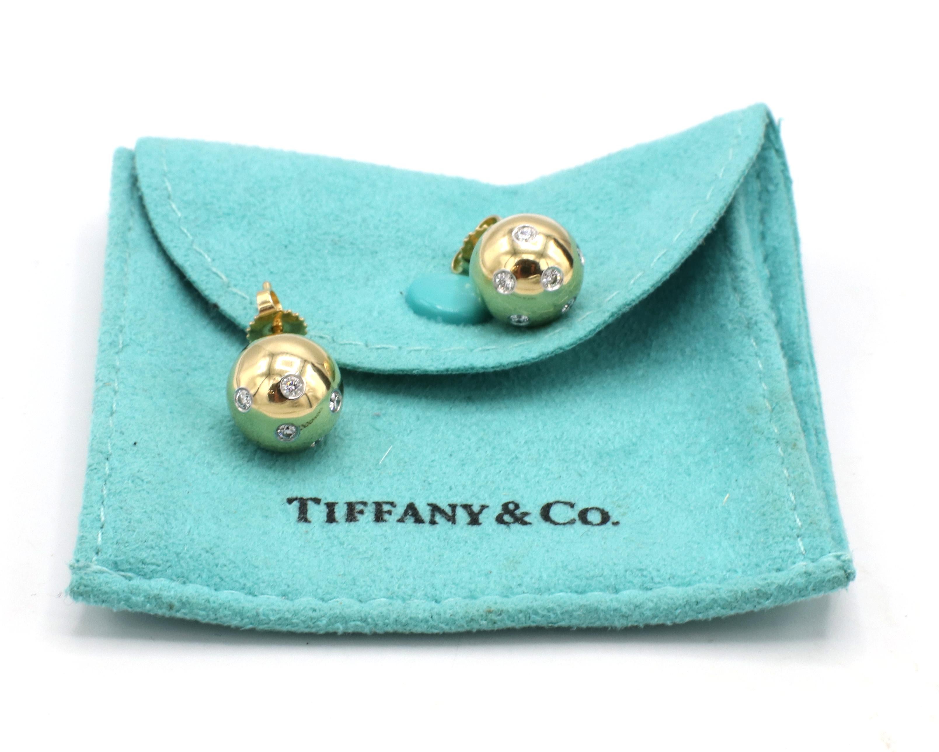 Tiffany & Co. Etoile Platinum & Gold Ball Stud Earrings 
Metal: Platinum & 18k yellow gold
Weight: 8.91 grams
Diameter: 11mm
Diamonds: Approx. .30 CTW round G VS diamonds
Signed: Tiffany & Co. 750 PT950
