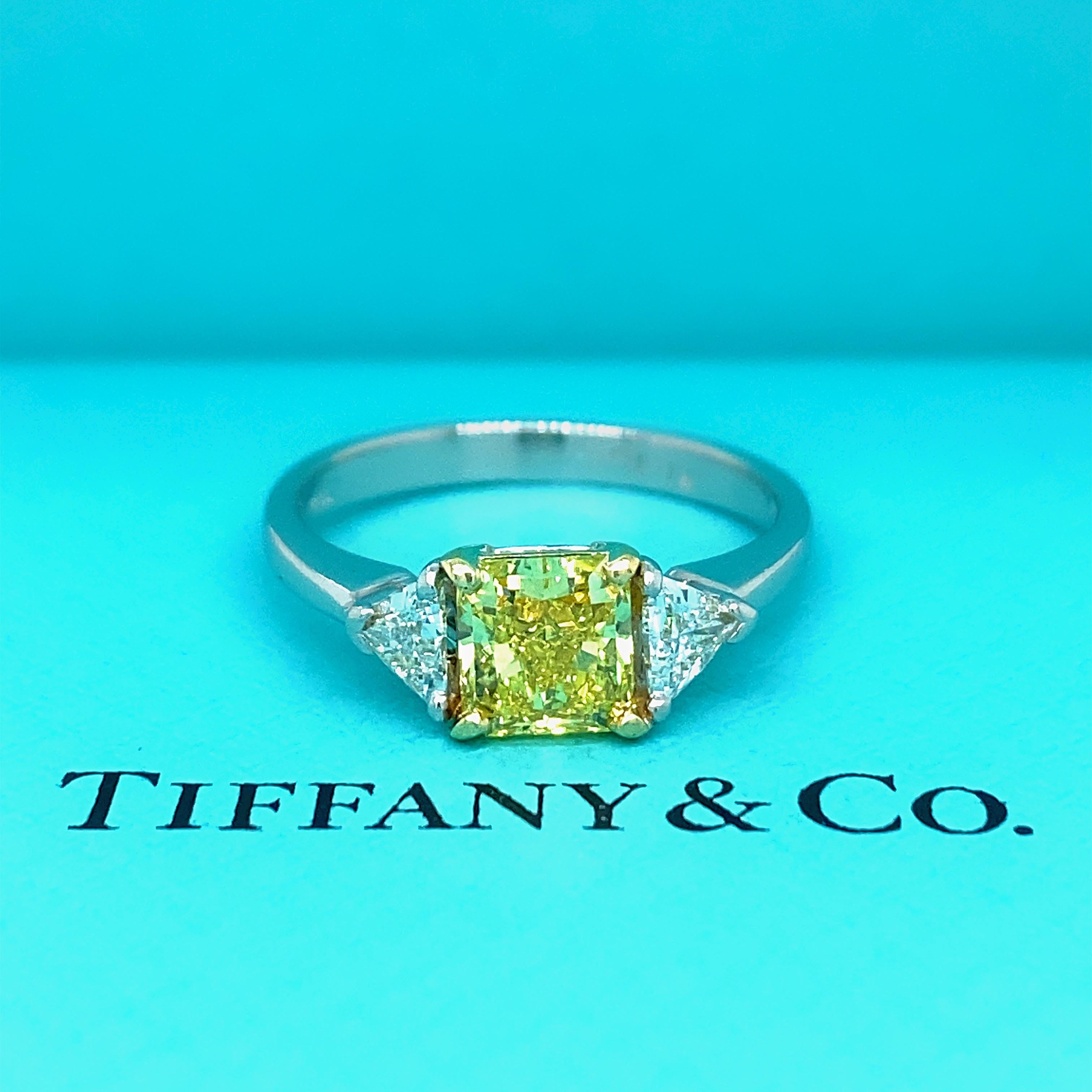 TIFFANY & CO. Fancy Vivid Yellow Radiant Diamond Three-Stone Engagement Ring

** This Beautiful and Unique Design has been retired and is no longer available *** 
Style:  Three-Stone
Ref. number:  T&C #D16603 - GIA Diamond Report #8585642
Metal: 