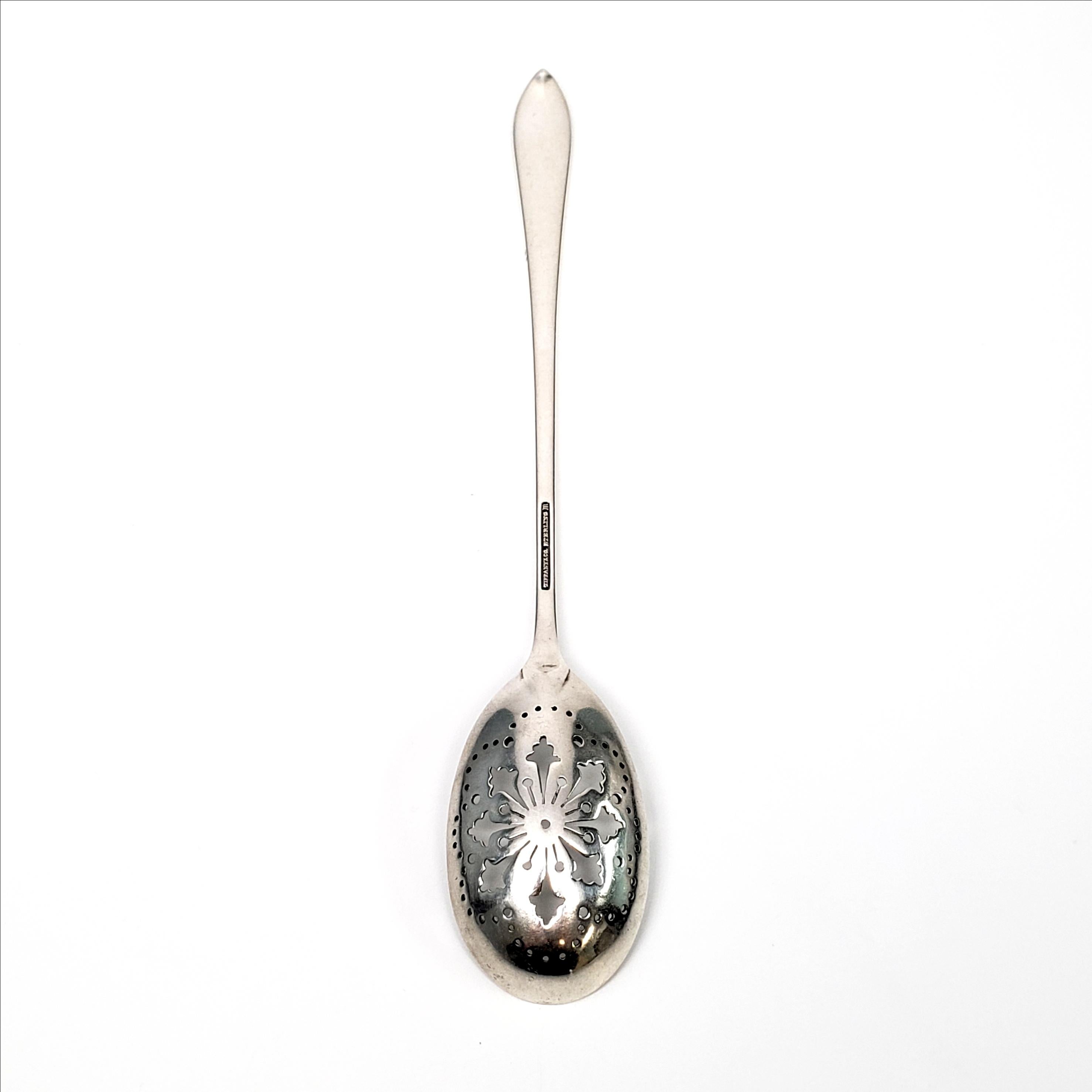 Vintage sterling silver pierced bowl, short handle olive spoon by Tiffany & Co. in the Faneuil pattern.

The Faneuil pattern was in production from 1910-1955 and was named for Faneuil Hall in Boston, MA. The pattern's simple and elegant design