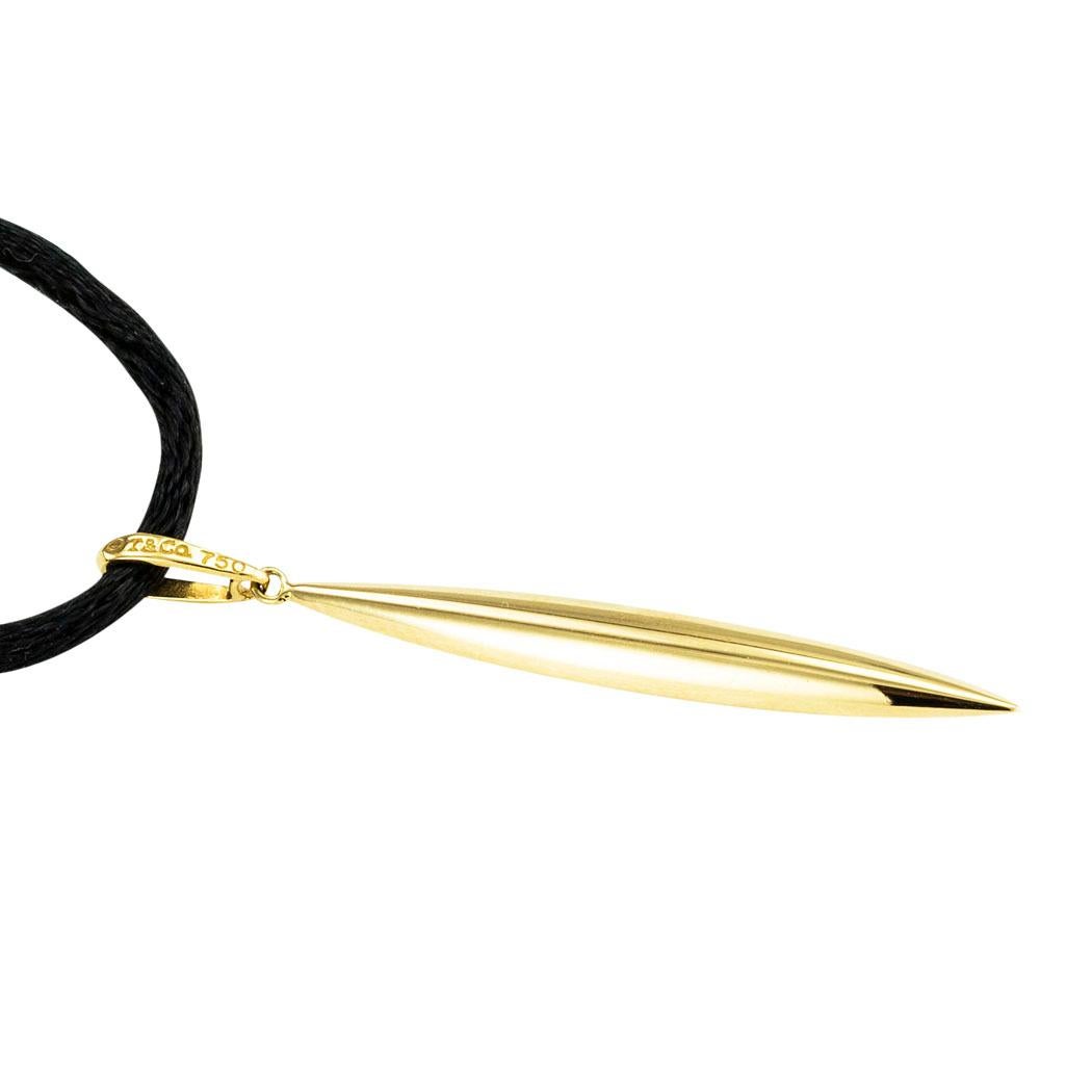 Tiffany & Co Feather yellow gold pendant, 1980s *

ABOUT THIS ITEM:  #N-DJ71H. Scroll down for specifications.  Delicate and whimsical, the narrow Feather pendant is a wonderful accessory for all ages.  Moreover, it is unmistakably Tiffany.  It