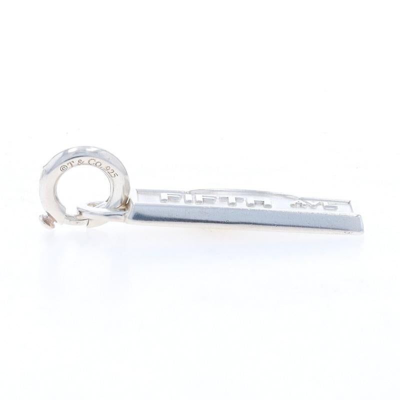 Brand: Tiffany & Co.

Metal Content: Sterling Silver

Fastening Type: Spring Ring Clasp
Theme: Fifth Avenue Street Sign, New York City

Measurements

Tall (from stationary bail): 1 1/4