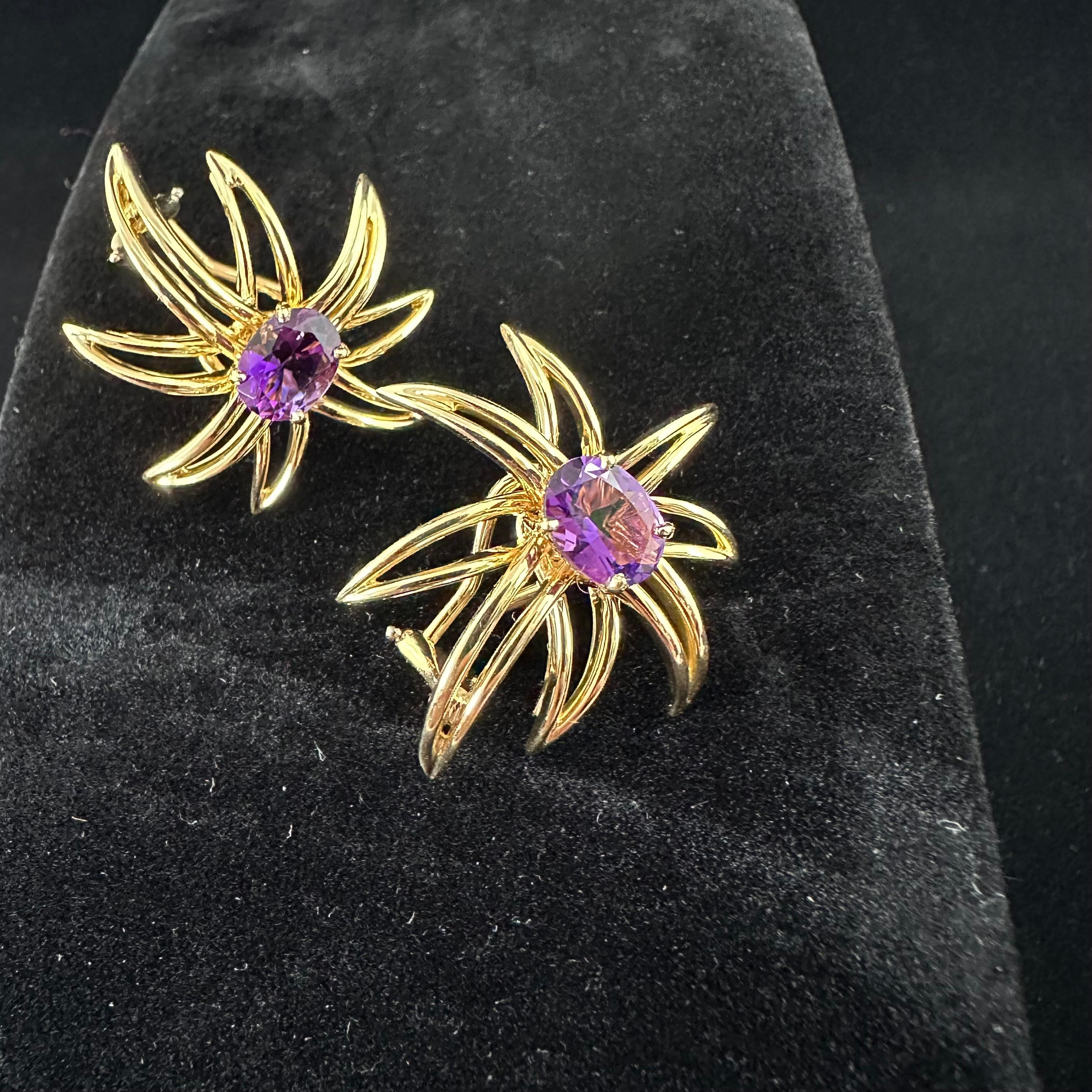 Tiffany And Co Amethyst Earrings.
From the now discontinued Fireworks Collection
Yellow Gold Earrings with Lever Backs  
Two Faceted Oval Amethyst 
Strong Purple Color Amethyst  approx 2cts total weight 
Signed Tiffany - Fireworks -18K

 
