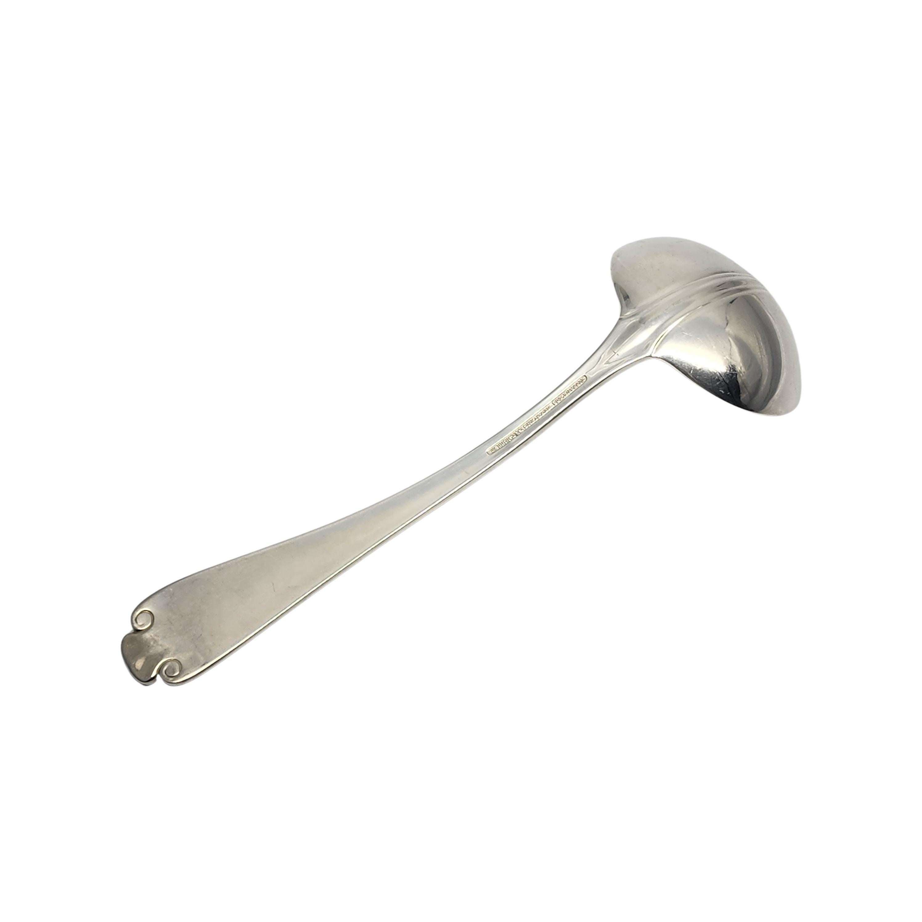 Sterling silver gravy ladle by Tiffany & Co in the Flemish pattern.

No monogram.

The Flemish pattern features a simple and elegant scroll design, making it a timeless classic that is still in demand today. Hallmarks date this piece to manufacture