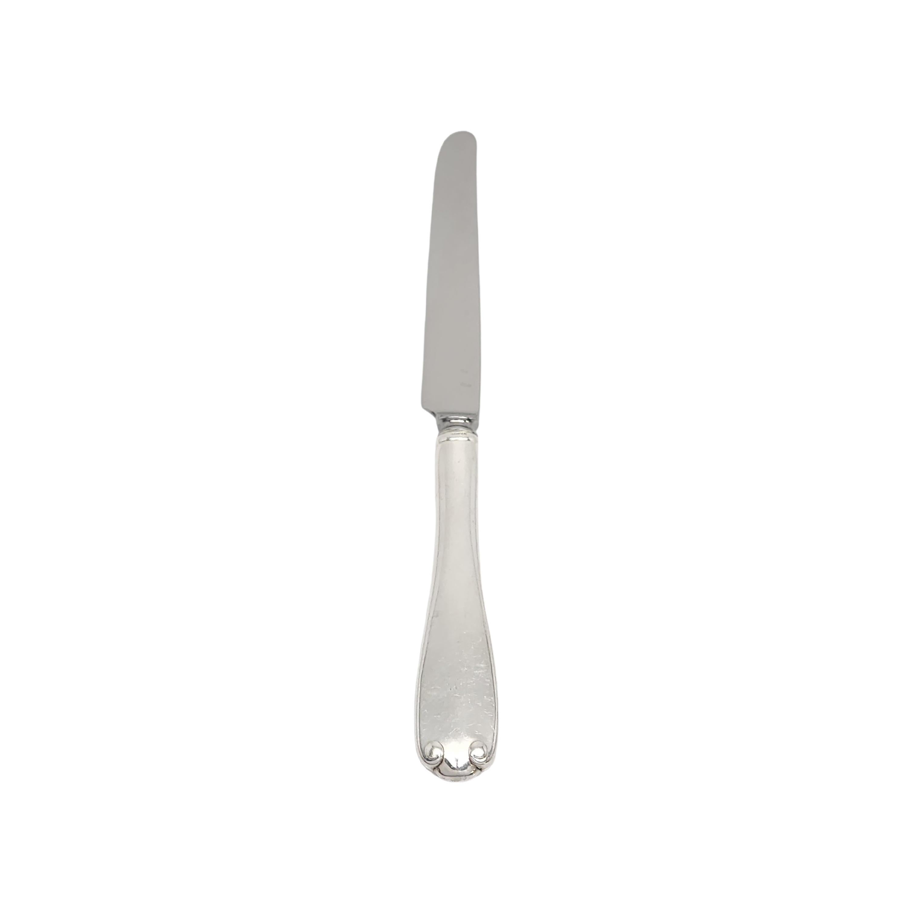 Sterling silver handle knife by Tiffany & Co in the Flemish pattern.

No monogram.

The Flemish pattern features a simple and elegant scroll design, making it a timeless classic that is still in demand today. Does not include Tiffany & Co box or