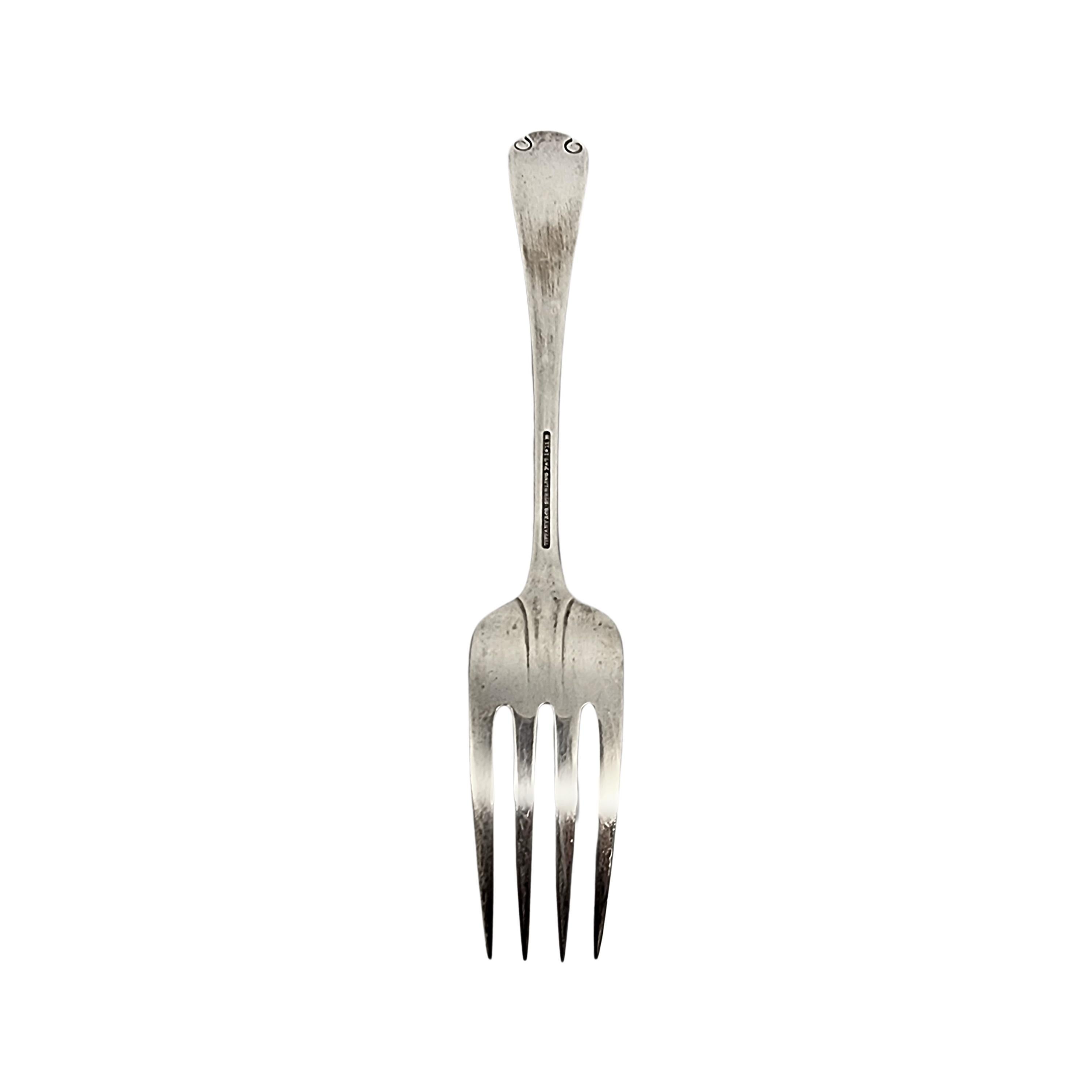 Sterling silver serving fork by Tiffany & Co in the Flemish pattern.

No monogram.

The Flemish pattern features a simple and elegant scroll design, making it a timeless classic that is still in demand today. Hallmarks date this piece to manufacture