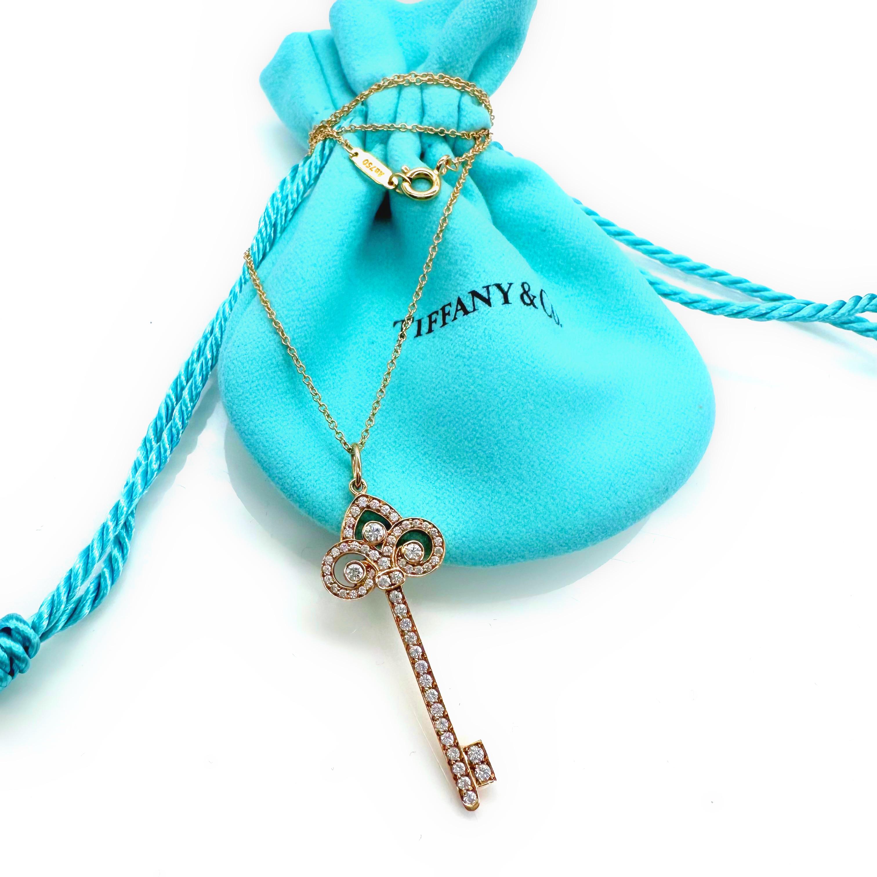 Tiffany & Co Fleur de Lis Diamond Key Pendant withChain 
Style:  Pendant Necklace
Ref. number:  GRP08993
Metal:  18kt Rose Gold
Size / Measurements:  Pendant 1.5' Inches / Chain 18' Inches
TCW:  0.40 tcw
Main Diamond:  60 Round Brilliant