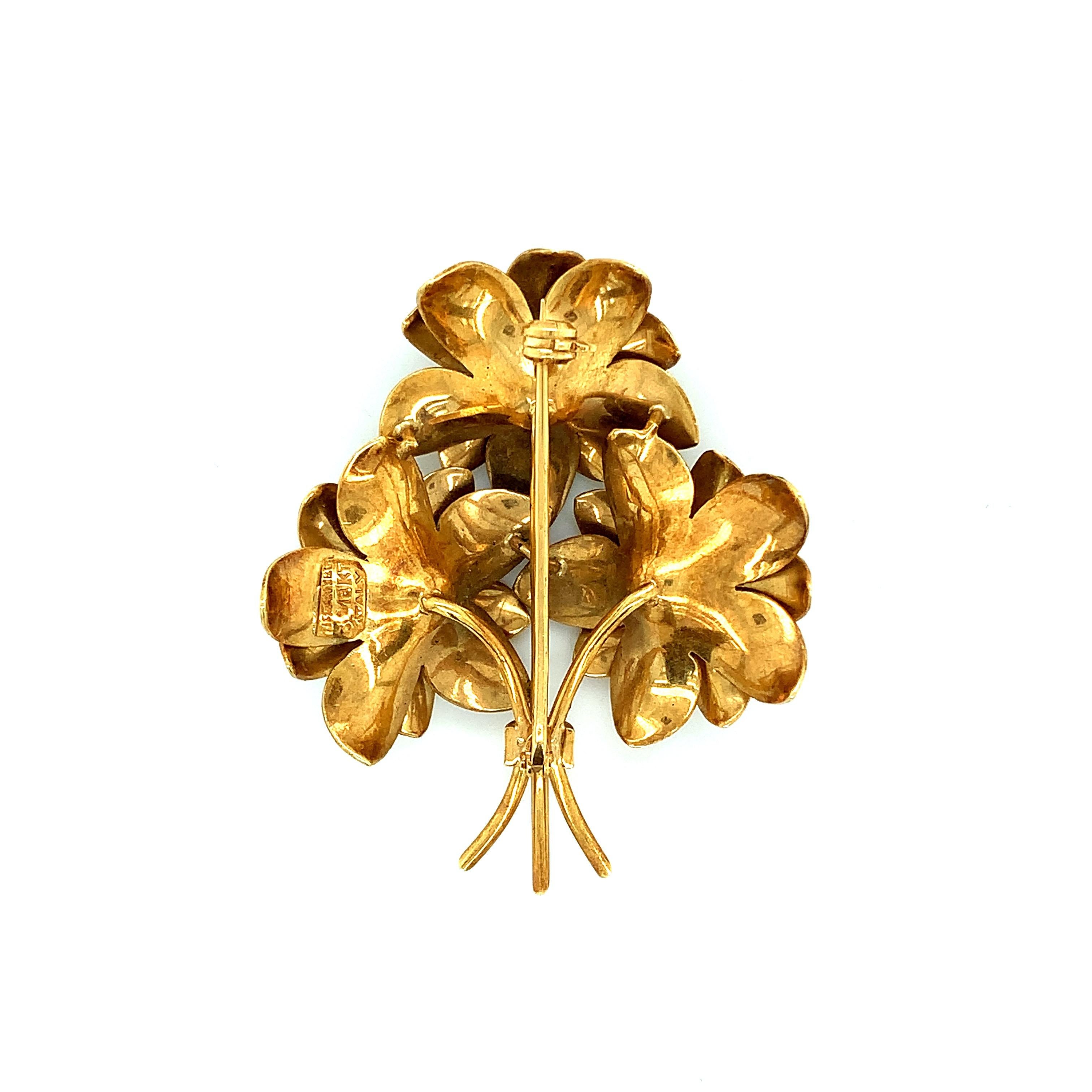 Tiffany & Co. 18 karat yellow gold brooch with a bouquet of flowers design. Made in Italy. Marked: Tiffany & Co. / 18K / Italy. Total weight: 16.9 grams. Width: 1.5 inch. Length: 1.88 inch. 