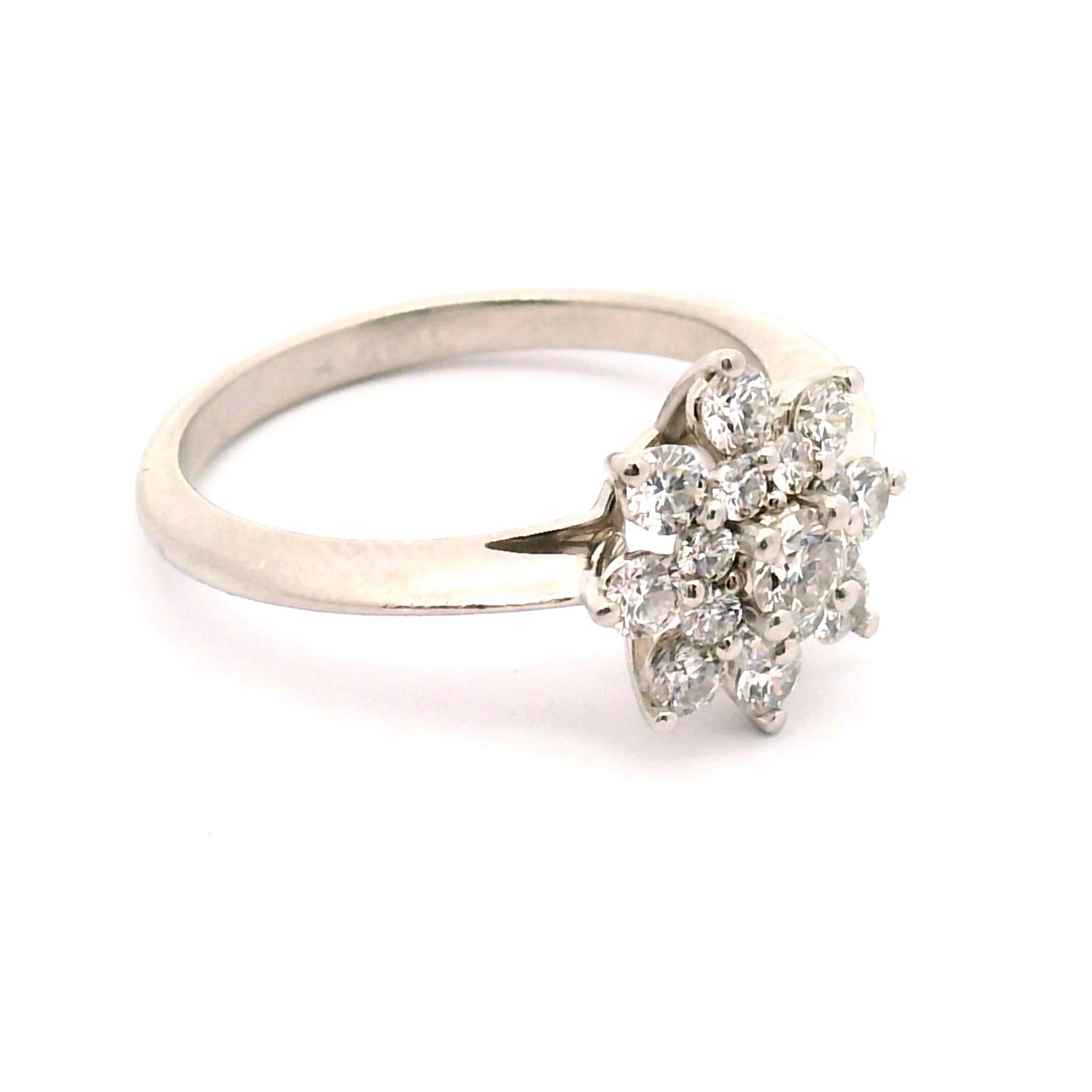 Tiffany & Co. Flower cluster with approximately .84cttw. of round brilliant cut diamonds. 
Platinum Knife edge band. 