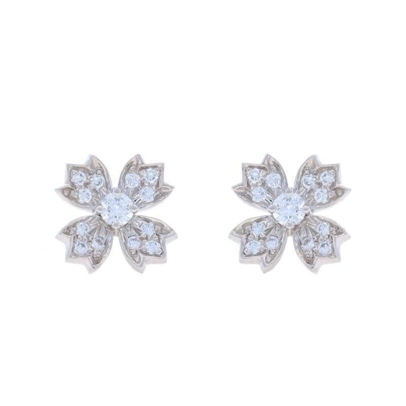 Brand: Tiffany & Co.
Design:  Flower Floret Cross

Metal Content: 950 Platinum

Stone Information

Natural Diamonds
Carat(s): .70ctw
Cut: Round Brilliant
Color: E - F
Clarity: VS1 - VS2

Total Carats: .70ctw

Style: Large Stud
Fastening Type: