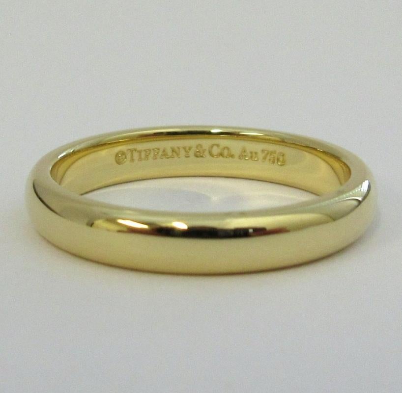 TIFFANY & Co. Forever 18K Gold 3mm Lucida Wedding Band Ring 4.5 

Metal: 18K Yellow Gold
Size: 4.5 
Band Width: 3mm
Weight: 3.10 grams
Hallmark: ©TIFFANY&CO. Au750
Condition: Excellent condition, like new
Tiffany Retail Price: $980

 Authenticity