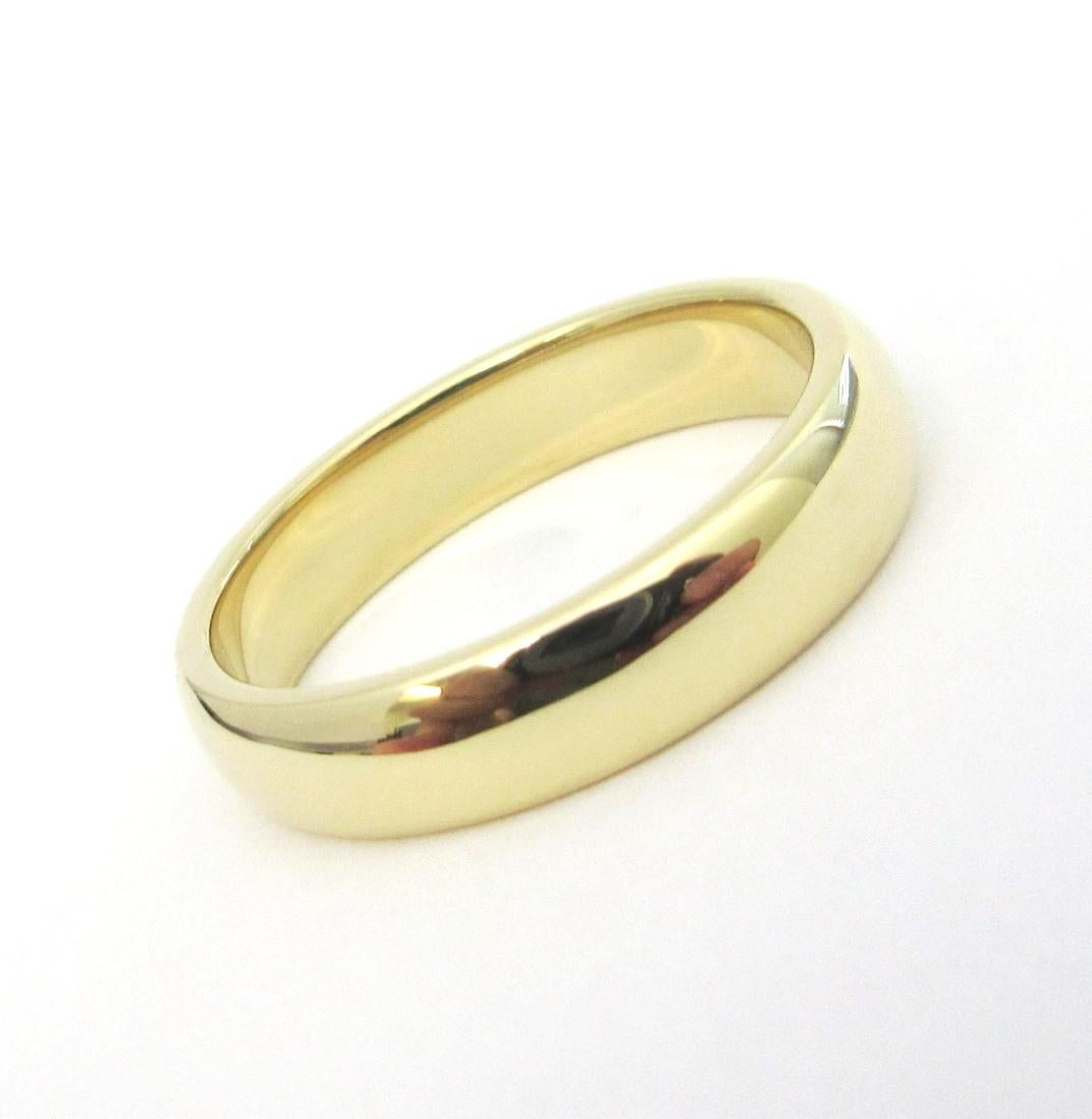 TIFFANY & Co. Forever Or 18K 4.5mm Lucida Wedding Band Ring 7 

Métal : Or jaune 18K
Taille : 7 
Largeur de la bande : 4,5 mm
Poids : 5.70 grammes
Poinçon : ©TIFFANY&CO. 750
Condit : Excellent état, comme neuf.
Valeur : 1 460

Authenticité garantie