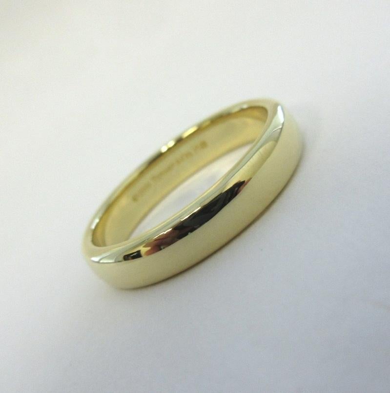 TIFFANY & Co. Forever Or 18K 4.5mm Lucida Wedding Band Ring 9.5

Métal : Or jaune 18K
Taille : 9.5
Largeur de la bande : 4,5 mm
Poids : 6,80 grammes
Poinçon : ©1999 TIFFANY&Co. 750
Condit : Excellent état, comme neuf.
Prix Tiffany : 1