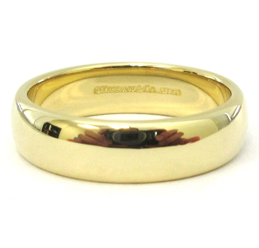 TIFFANY & Co. Forever 18K Gold 6mm Lucida Wedding Band Ring 9.5 

Metal: 18K Yellow Gold
Size: 9.5 
Band Width: 6mm
Weight: 9.70 grams
Hallmark: ©TIFFANY&CO. AU750
Condition: Excellent condition, like new
Value: $2,100

Authenticity Guaranteed