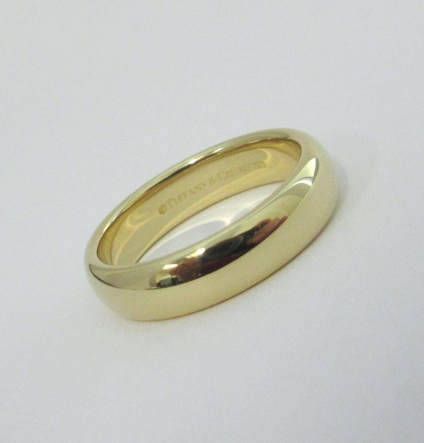 TIFFANY & Co. Forever 18K Yellow Gold 4.5mm Lucida Wedding Band Ring 5.5 

Metal: 18K Yellow Gold
Size: 5.5 
Band Width: 4.5mm
Weight: 5.80 grams
Hallmark: ©TIFFANY&CO. AU750
Condition: Excellent condition, like new
Tiffany price: