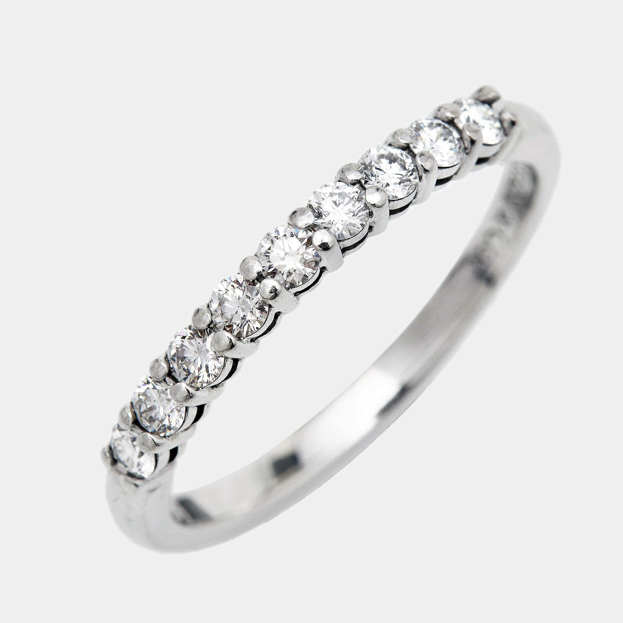 The Tiffany & Co. Forever Eternity ring is an exquisite piece of jewelry crafted with timeless elegance. Made from luxurious platinum, it features a half circle of sparkling, brilliant-cut diamonds, symbolizing eternal love and commitment in a