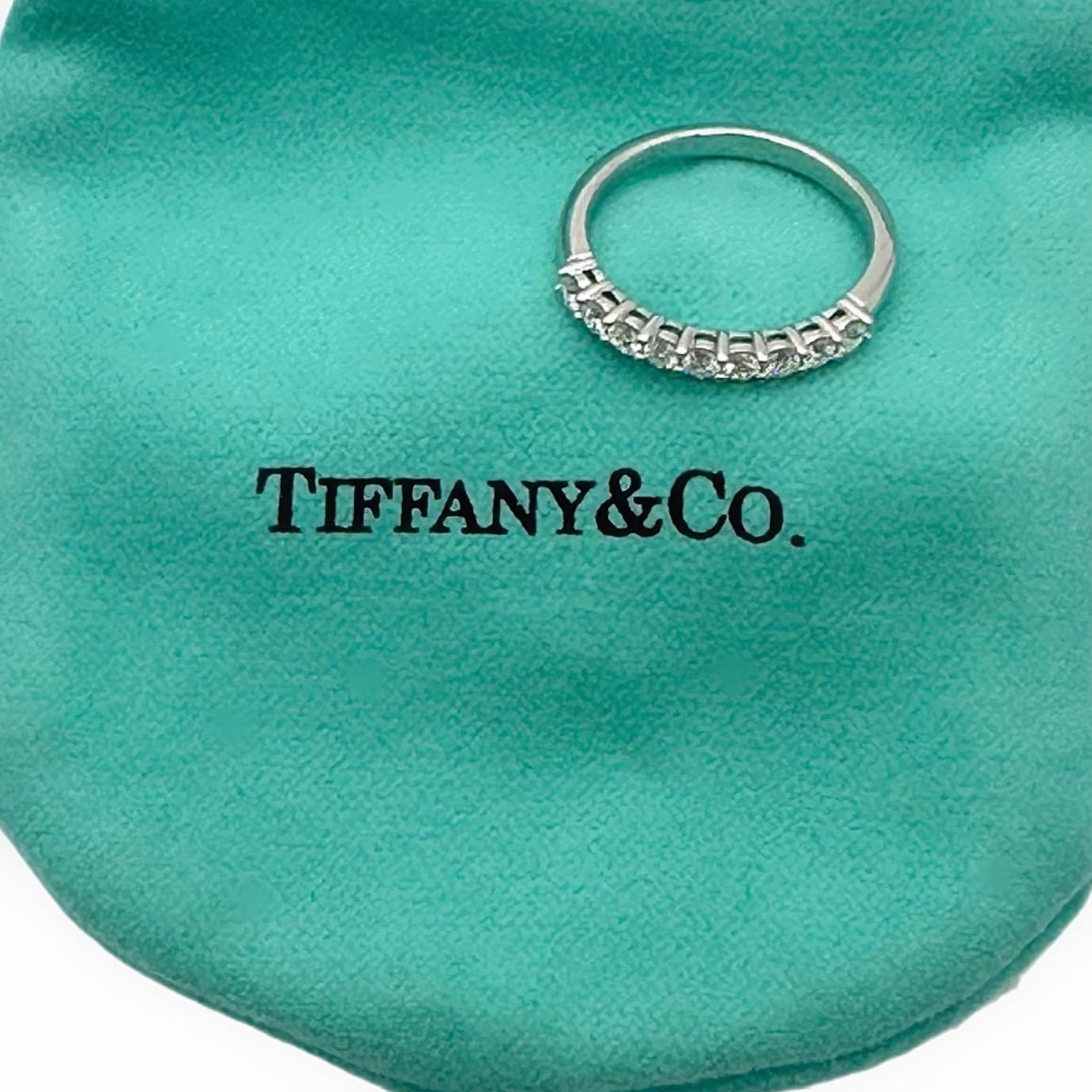 Tiffany & Co. FOREVER Half-circle diamond Band Ring
Style:  Prong-set
Metal:  Platinum Pt950
Size / Measurements:  2.2 mm
Ring size;  5 sizable
TCW:  ~ 0.27 tcw
Main Diamond:  9 Round Brilliant Diamonds
Hallmark:  ©TIFFANY&CO. Pt950
Includes:  T&C