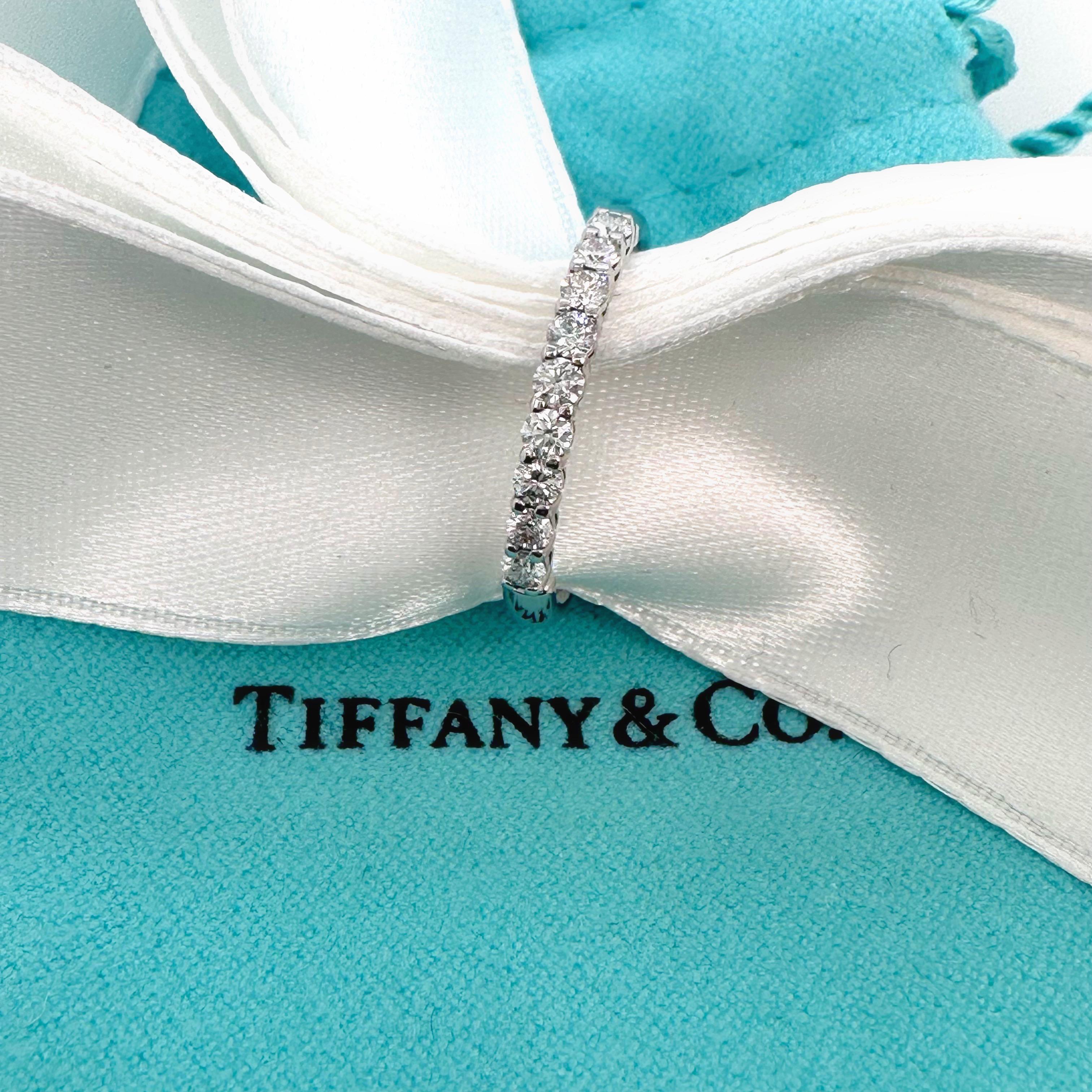 Tiffany & Co. Forever Half Circle Diamond Band
Style:  Band
Ref. number:  600034405
Metal:  Platinum PT950
Size:  6.75 sizable
Measurements:  2.2 mm
TCW:  0.27 tcw
Main Diamond:  9 Round Brilliant Diamonds
Hallmark:  TIFFANY&CO. PT50
Includes:  T&C
