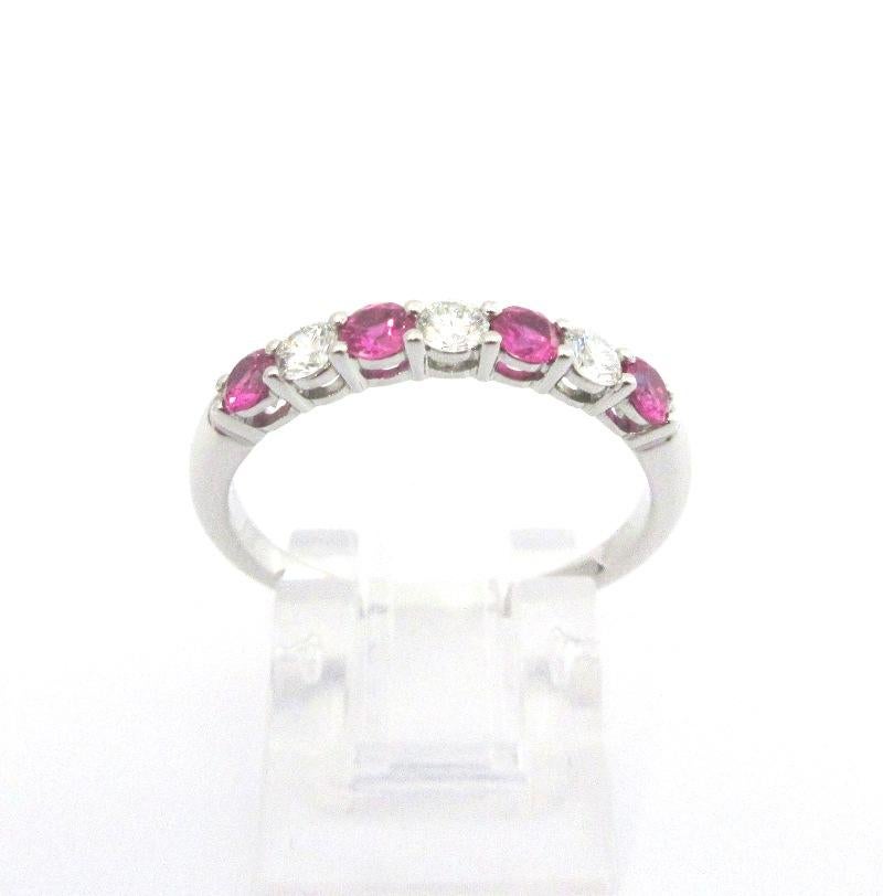TIFFANY & Co. Forever Platinum 3mm Half Circle Diamond Pink Sapphire Band Ring 8

Metal: Platinum
Size: 8
Band Width: 3mm
Weight: 4.0 grams
Diamond: 3 round brilliant diamonds, carat total weight .24
Pink Sapphire: 4 round pink sapphires, carat
