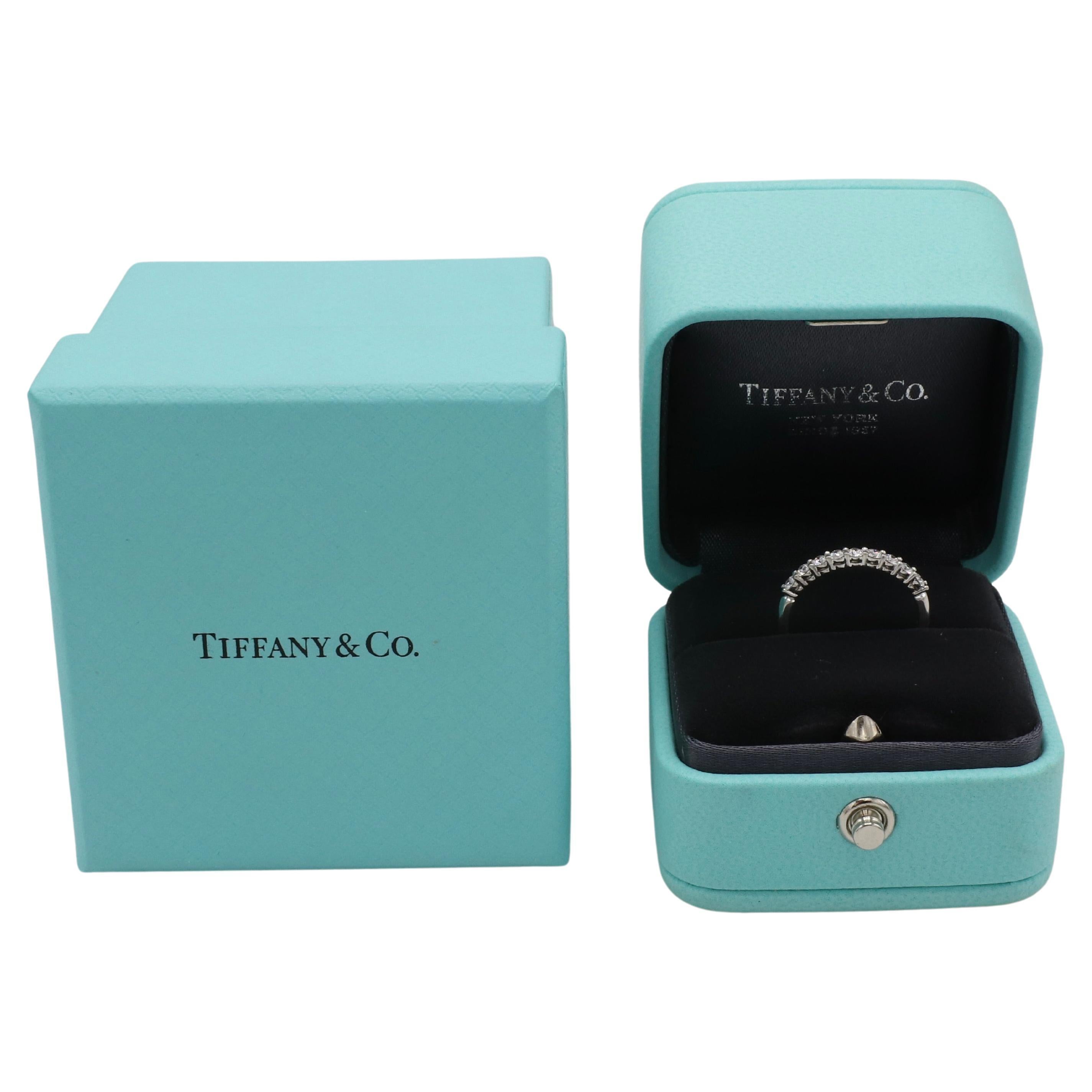 Tiffany & Co. Forever Platinum Natural Diamond Half Band Ring 
Metal: Platinum
Weight: 2.48 grams
Diamonds: Approx. .27 CTW F-G VS round natural diamonds
Width: 2mm
Size: 5 (US)
Height: 2mm
Signed: ©Tiffany & Co. PT950
Retail: $4,000 USD