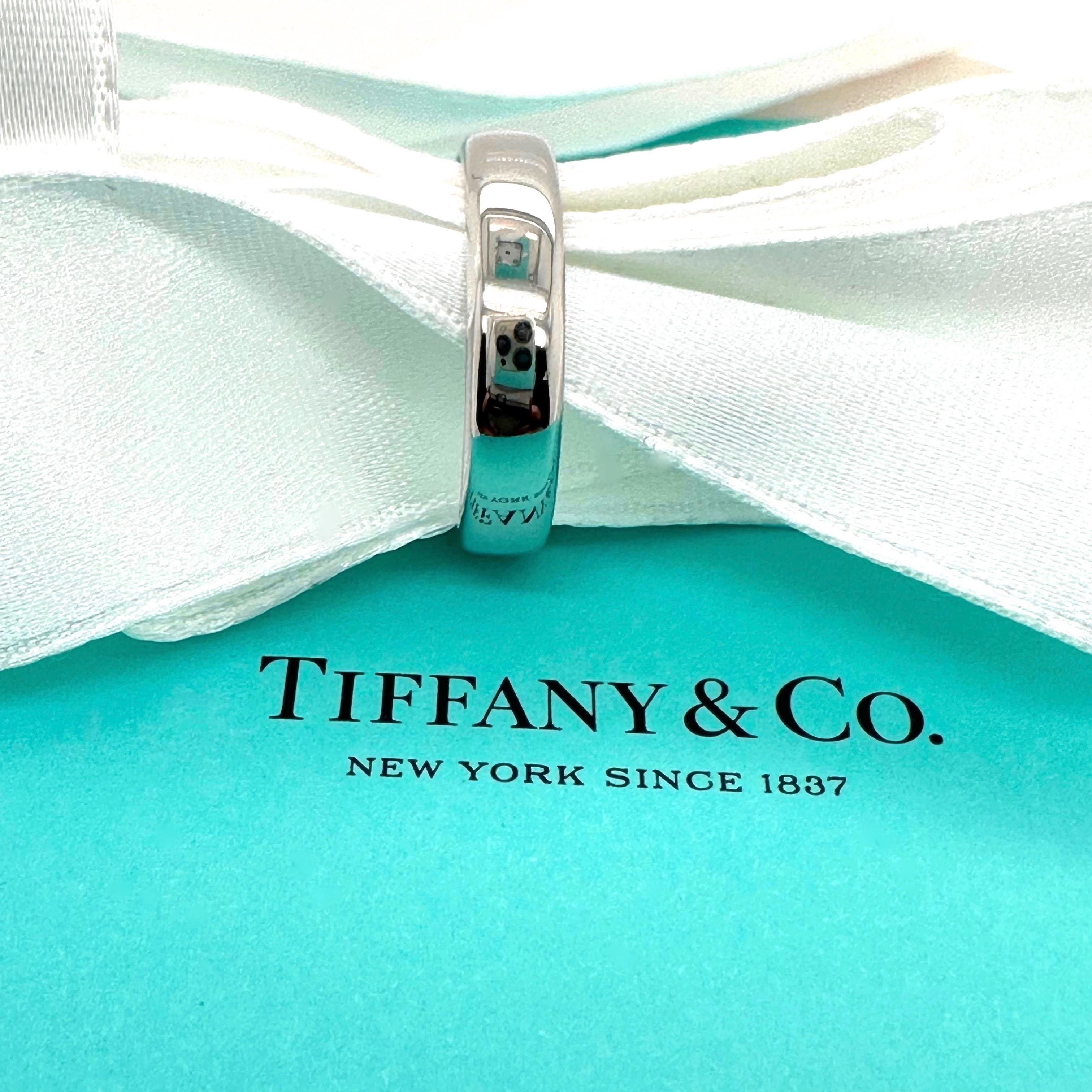Tiffany & Co. Forever Wedding Band Ring
Style:  Band
Ref. number:   6002585
Metal:  Platinum 950
Size:  8 sizable
Measurements:  4.5 MM
Hallmark:  ©1999 TIFFANY&CO. PT 950
Includes:  T&C Jewelry Envelope
Retail:  $2,200
Sku#11500TDE-OFC