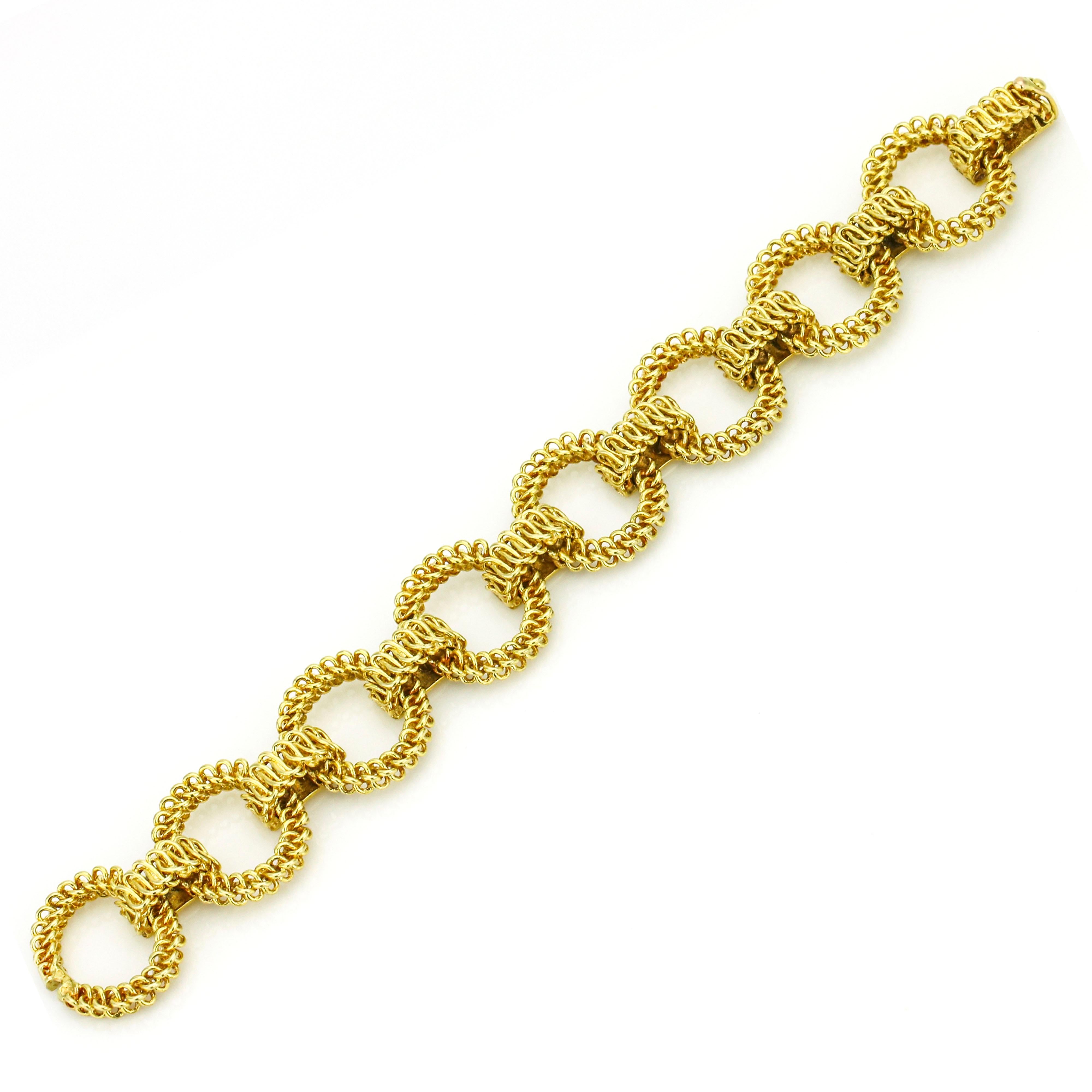 Vintage Tiffany & Co. textured open link bracelet in 18-karat yellow gold. Circa 1960s. Made in France. Hidden clasp with safety. Size medium.