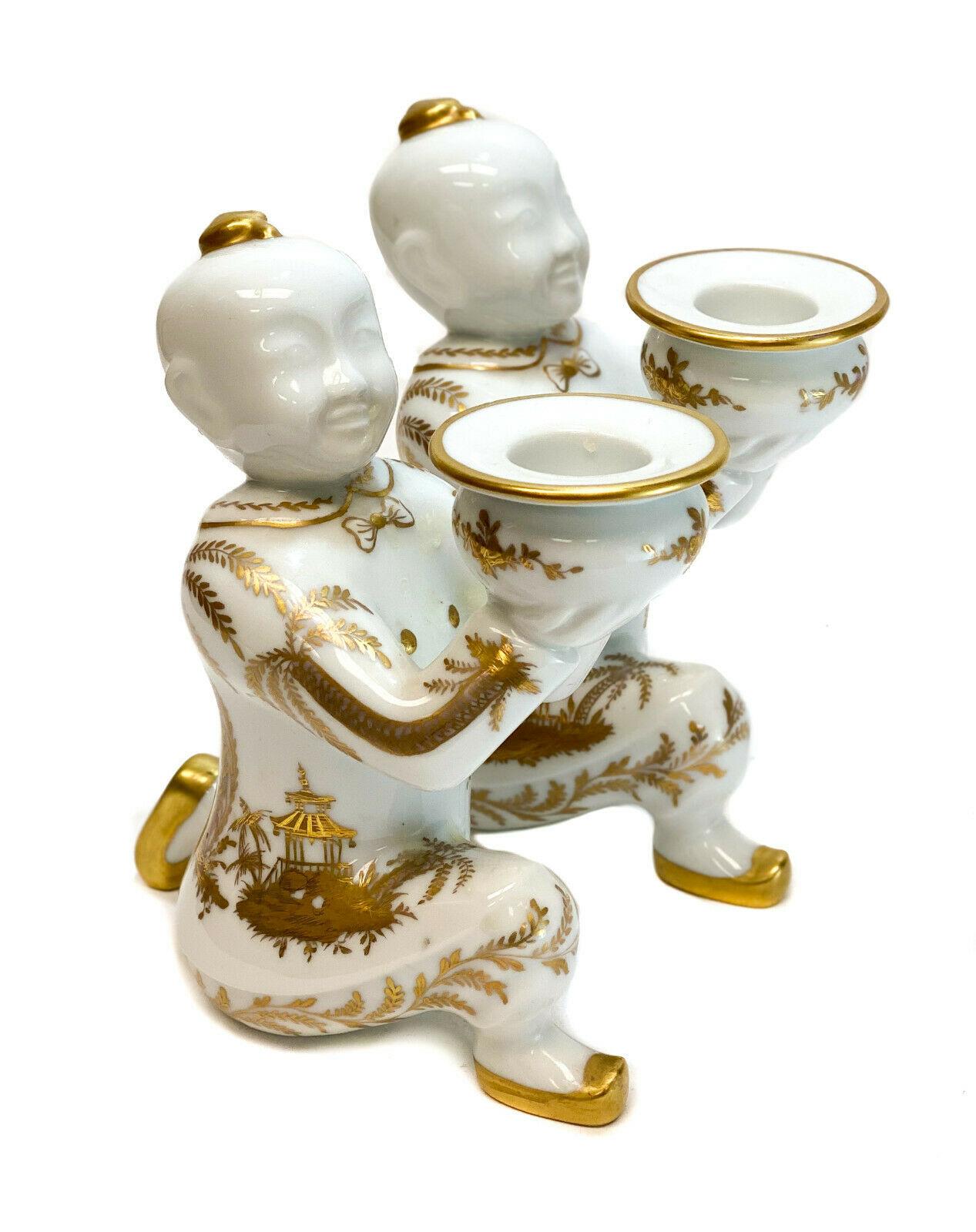 Tiffany & Co. France Private Stock Le Tallec candlesticks in doré Chinois Cirque. The candlesticks depict two chinosorie males kneeling and holding up a bowl. Beautiful gold palm trees and temples all-over the bodies. Tiffany & Co. France Private