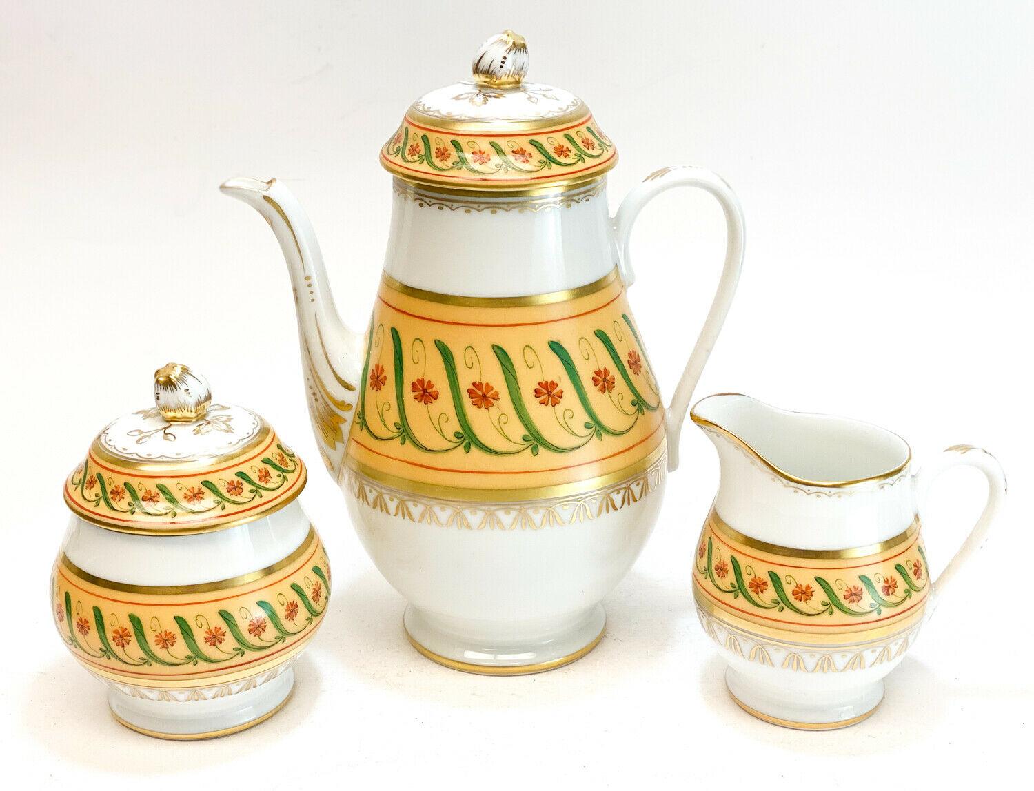 Tiffany & Co. Private Stock Le Tallec porcelain tea and dessert in Directoire. Yellow grounds with hand painted flowers and leaves along the rim. Large gilt floral medallions to the center of the saucers. Tiffany Private Stock mark with the Le