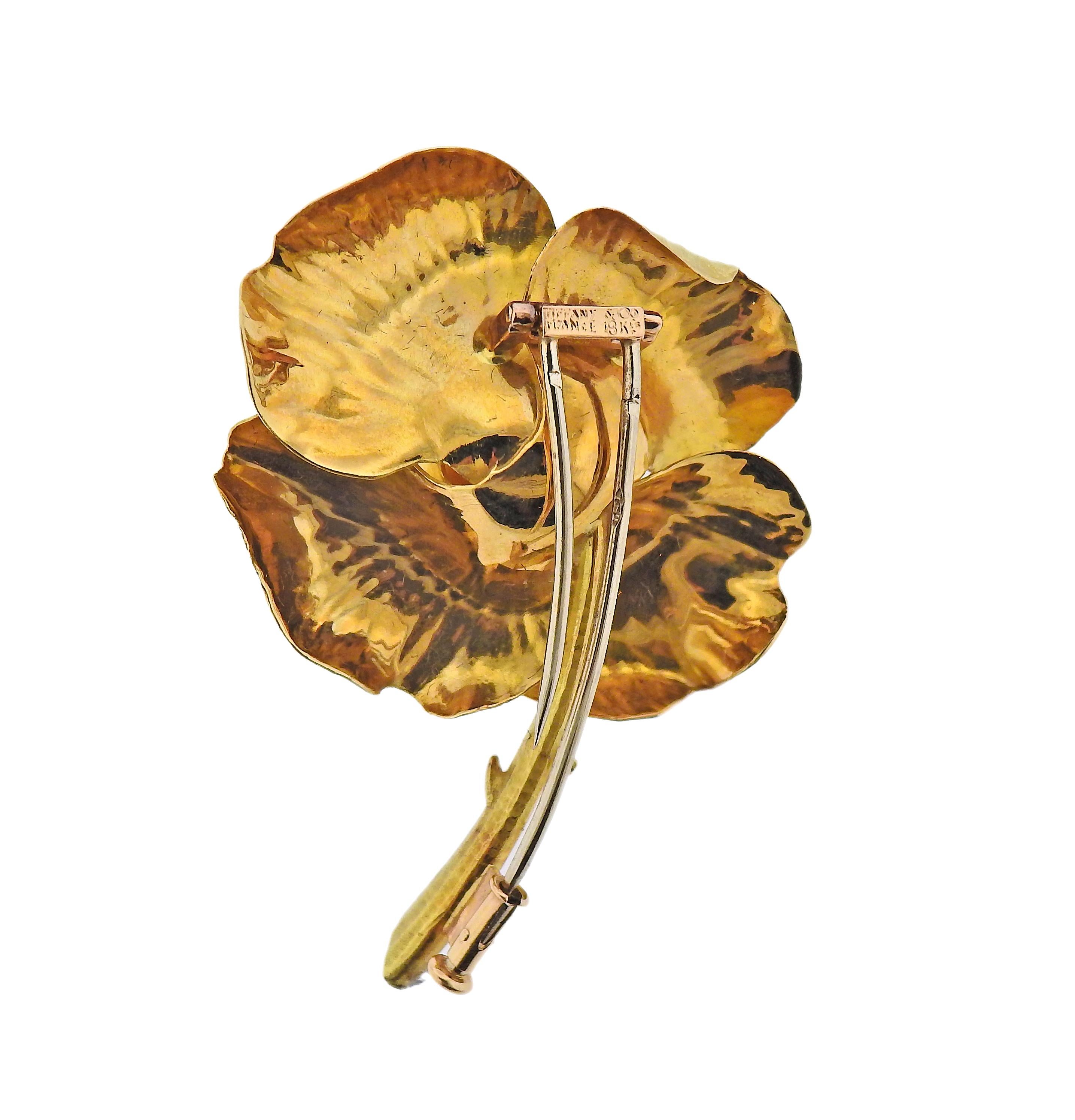 Made in France by Tiffany & Co, in 18k gold, rose flower brooch. Measuring 50mm x 38mm. Marked: Tiffany & Co, France, 18kts. Weight - 16.5 grams.