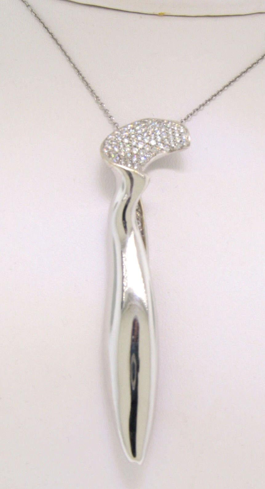 This 100% authentic Tiffany & Co. piece was designed by Frank Gehry and was crafted in solid 18k white gold. The top part of this Orchid pendant is elegantly covered in pavé set round brilliant cut diamonds which weigh an approximate total of 0.95