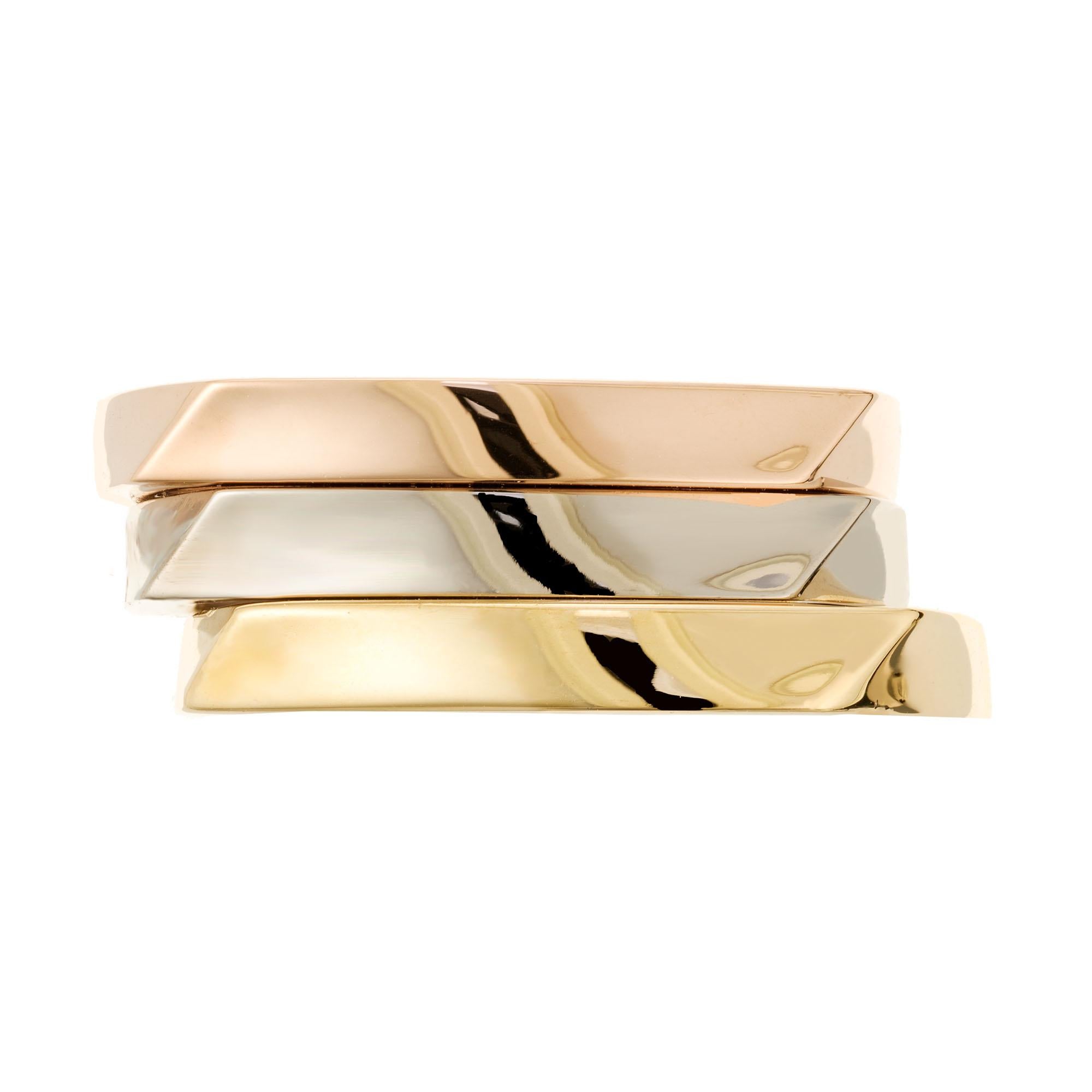 Tiffany & Co torque three ring. 18k rose, yellow and white gold by architect Frank Gehry. Not sizable.

Size 7.5 not sizable 
18k rose gold
18k yellow gold 
18k white gold 
Stamped: 750
19.3 grams
Width at top: 2.97mm
Height at top: 2.36mm
Width at