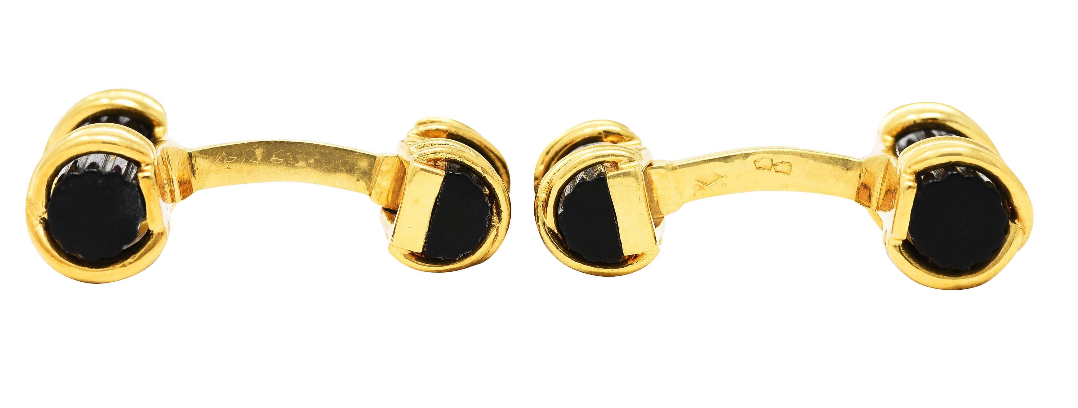 Leverback cufflinks with bar terminals comprised of carved horn

Horn is opaque brown to black with moderate striation and good polish

Fluted horn is encompassed by a stylized polished gold X motif

Stamped 18k with French assay marks for 18 karat
