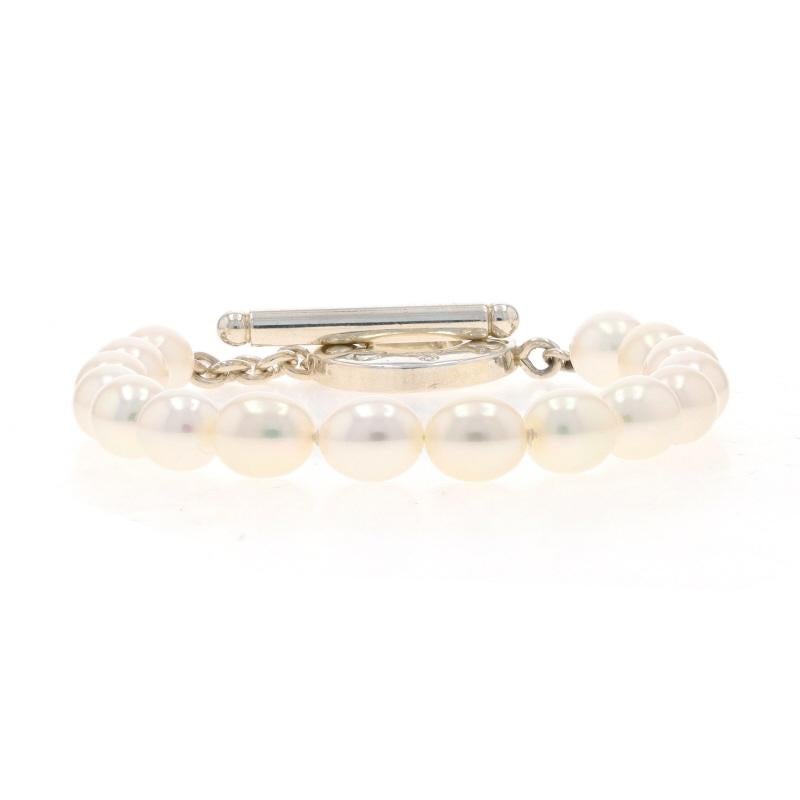 Retail Price: $600

Brand: Tiffany & Co.
Design:  Toggle Bracelet

Metal Content: Sterling Silver

Stone Information
Freshwater Pearls
Color: White

Style: Strand
Fastening Type: Toggle Clasp

Measurements
Length: 7 1/4