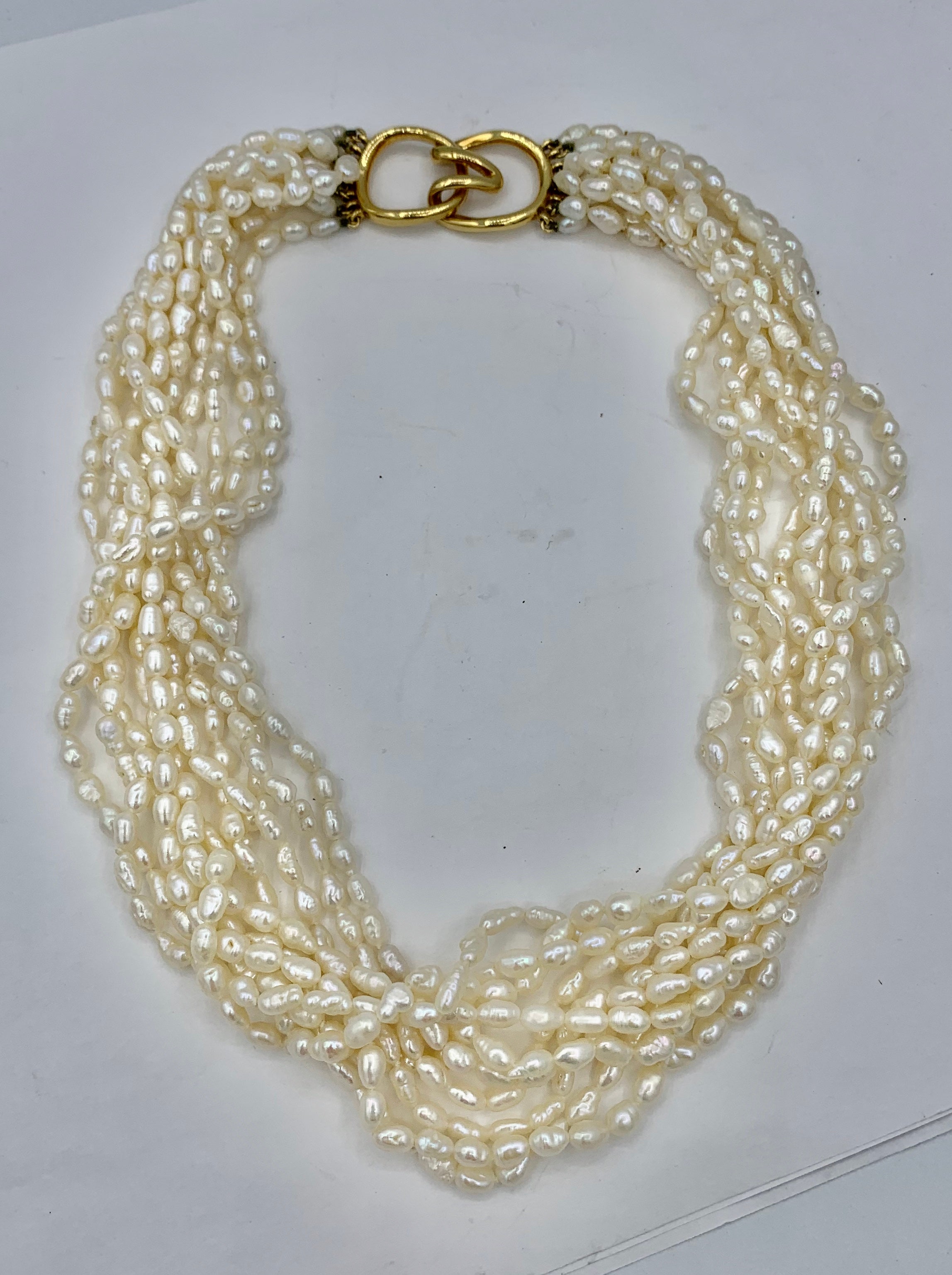 This is a stunning vintage Tiffany & Co. Freshwater Pearl Torsade Necklace with an 18 Karat Yellow Gold signed Tiffany clasp.  The Tiffany torsade necklace has ten strands of freshwater biwa pearls.  The necklace is signed Tiffany & Co.  The