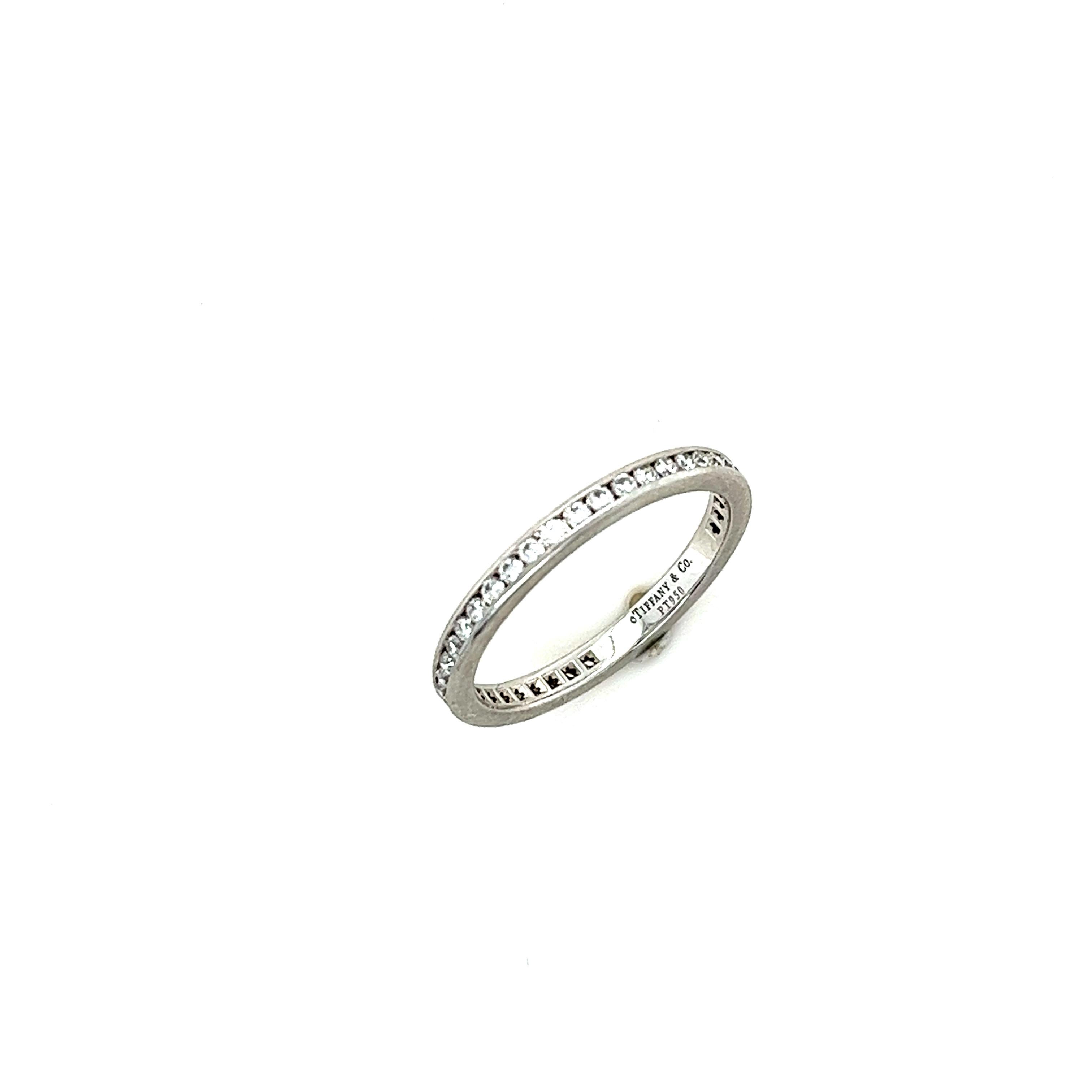 A Tiffany & Co Diamond Full Circle Wedding Ring, with 42 round brilliant cut diamonds channel set in platinum on a 2.3mm band.

Diamonds 42 = 0.55ct (estimated), F/VS
Metal: Platinum PT950
Carat: 0.55ct
Colour: F
Clarity: VS
Cut: Round