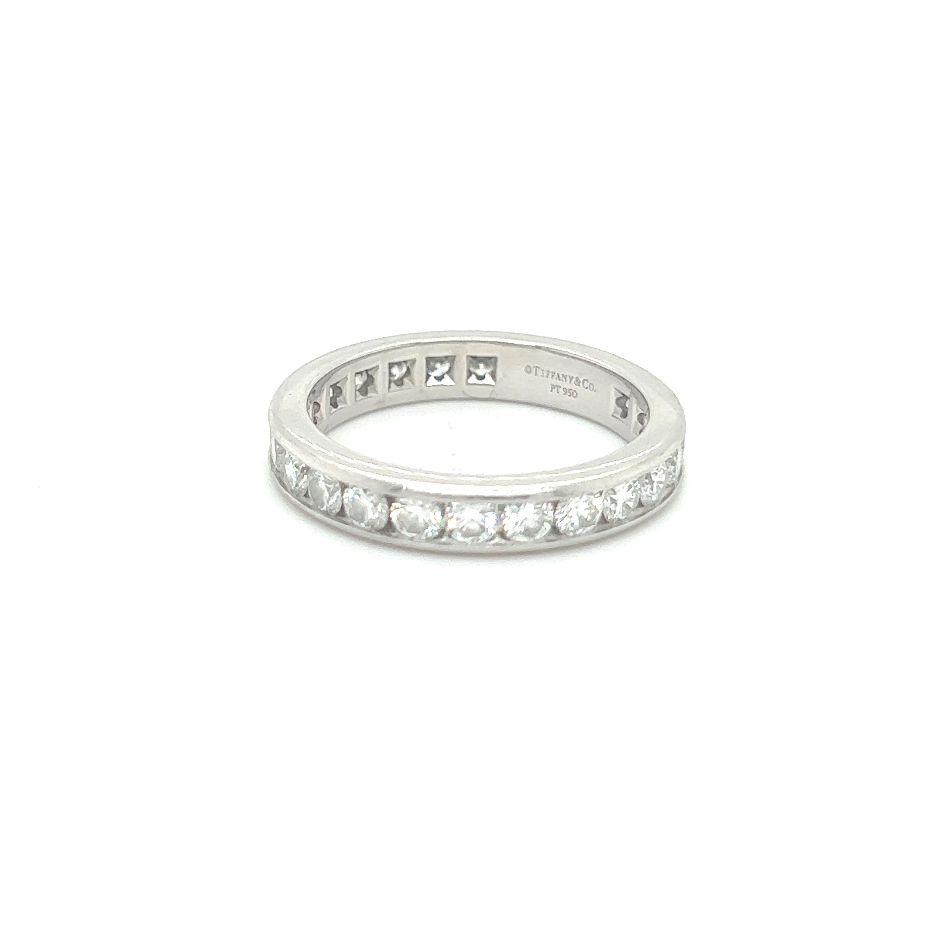 A Tiffany and Co. diamond eternity ring, set with round brilliant cut diamonds in a channel setting around the full circumference, with a total estimated diamond weight of 2.40ct, F, G Colour VS 

Signed  'Tiffany & Co. PT 950', ring size T 1/2.