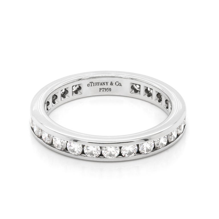 This stunning eternity ring by Tiffany & Co. is channel set with 26 round brilliant cut diamonds inlaid all the way around a 3mm platinum band. The band is set with a total diamond weight of 0.93ct with all diamonds grading between IF-VS2 in clarity