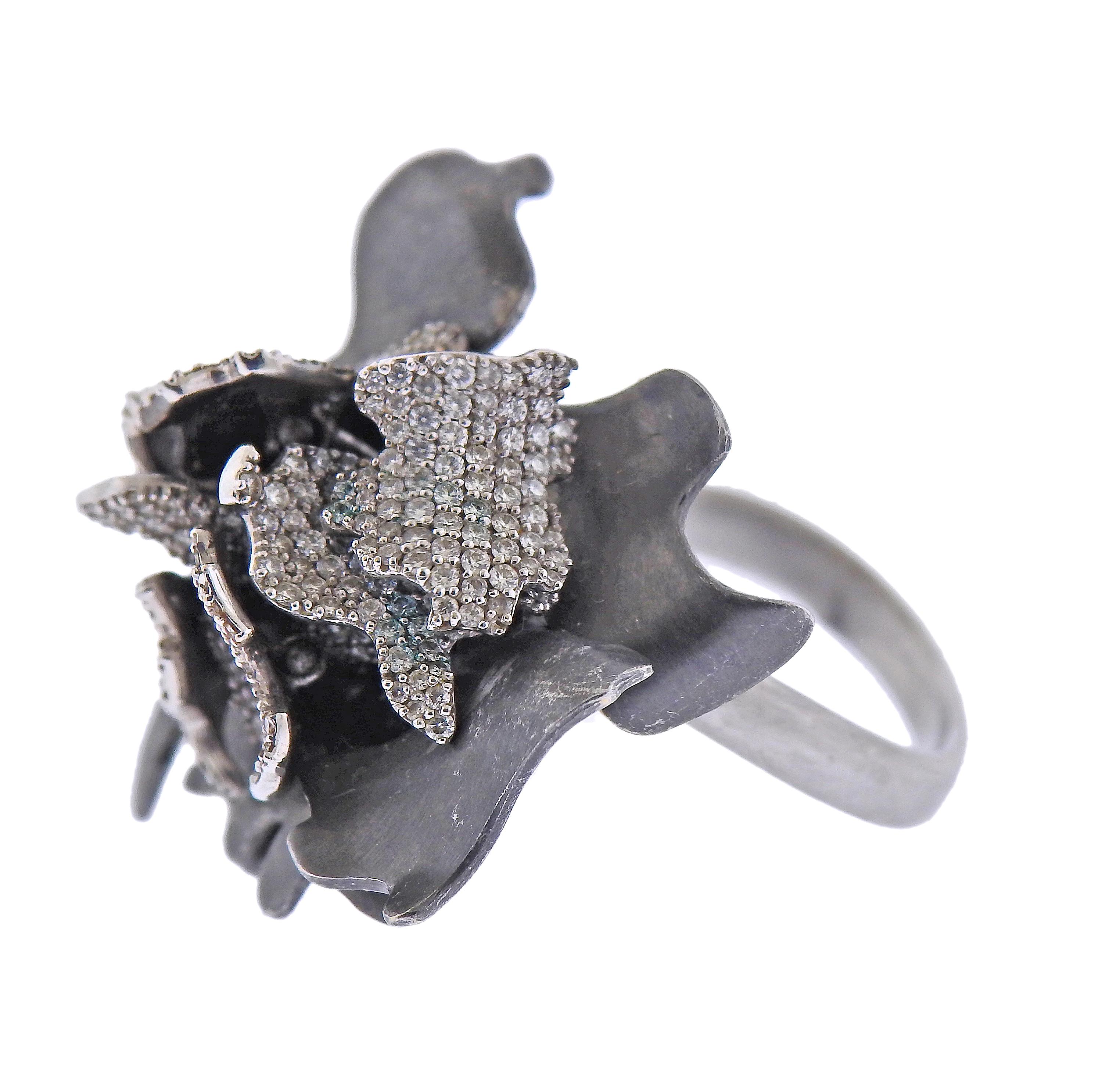 18k blackened gold flower ring, designed by Frank Gehry for Tiffany & Co, with approx. 0.46ctw in diamonds, featuring movable petals/leaves. Ring size - 7, ring top - 25mm x 26mm. Marked: Gehry, Tiffany & Co, 750. Weight - 11.8 grams. 