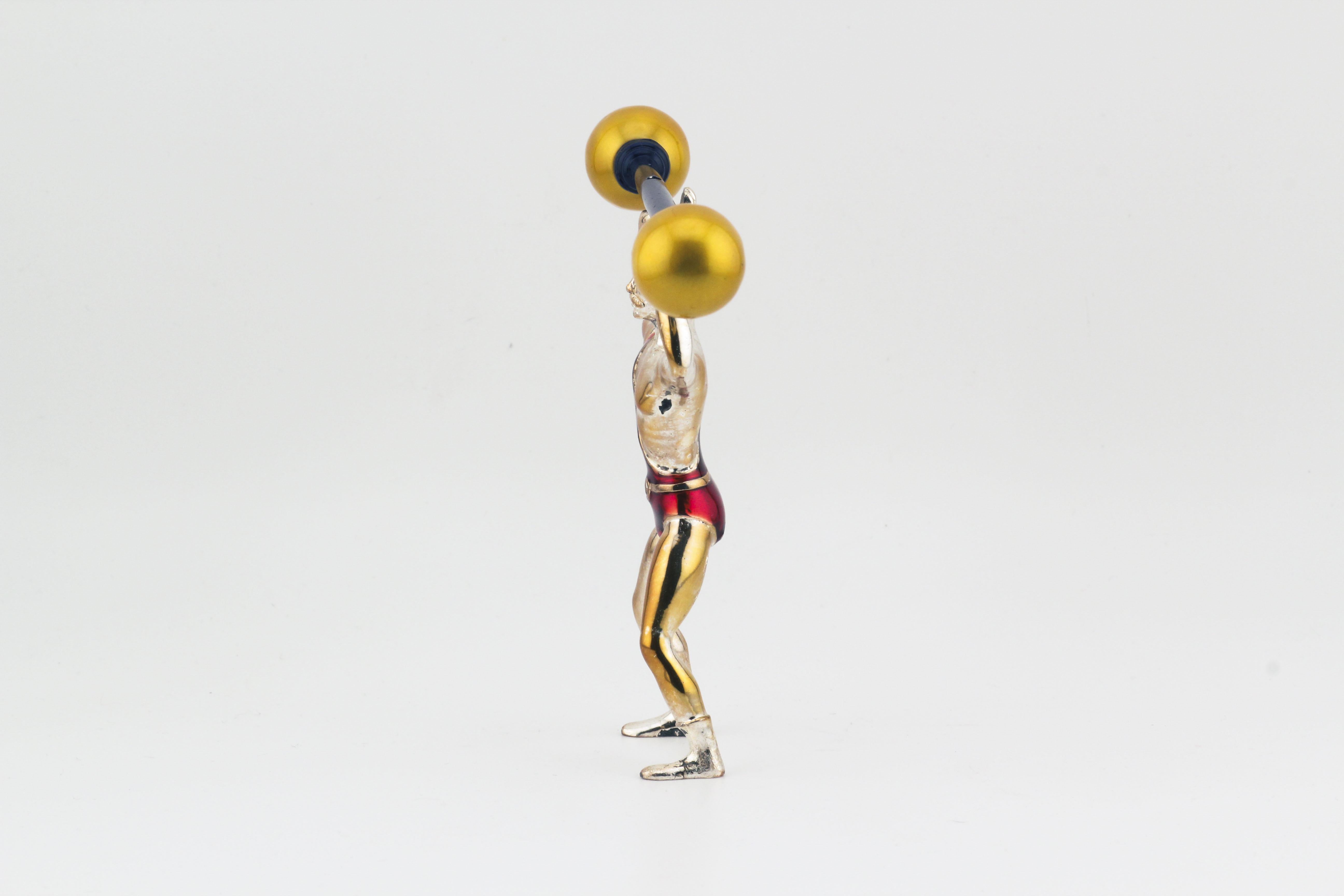 The Tiffany & Co. Gene Moore Sterling Silver & Enamel Circus Strongman is a charming, whimsical piece that beautifully captures the artistry and playful spirit of the circus. Designed by Gene Moore, renowned for his imaginative window displays, this