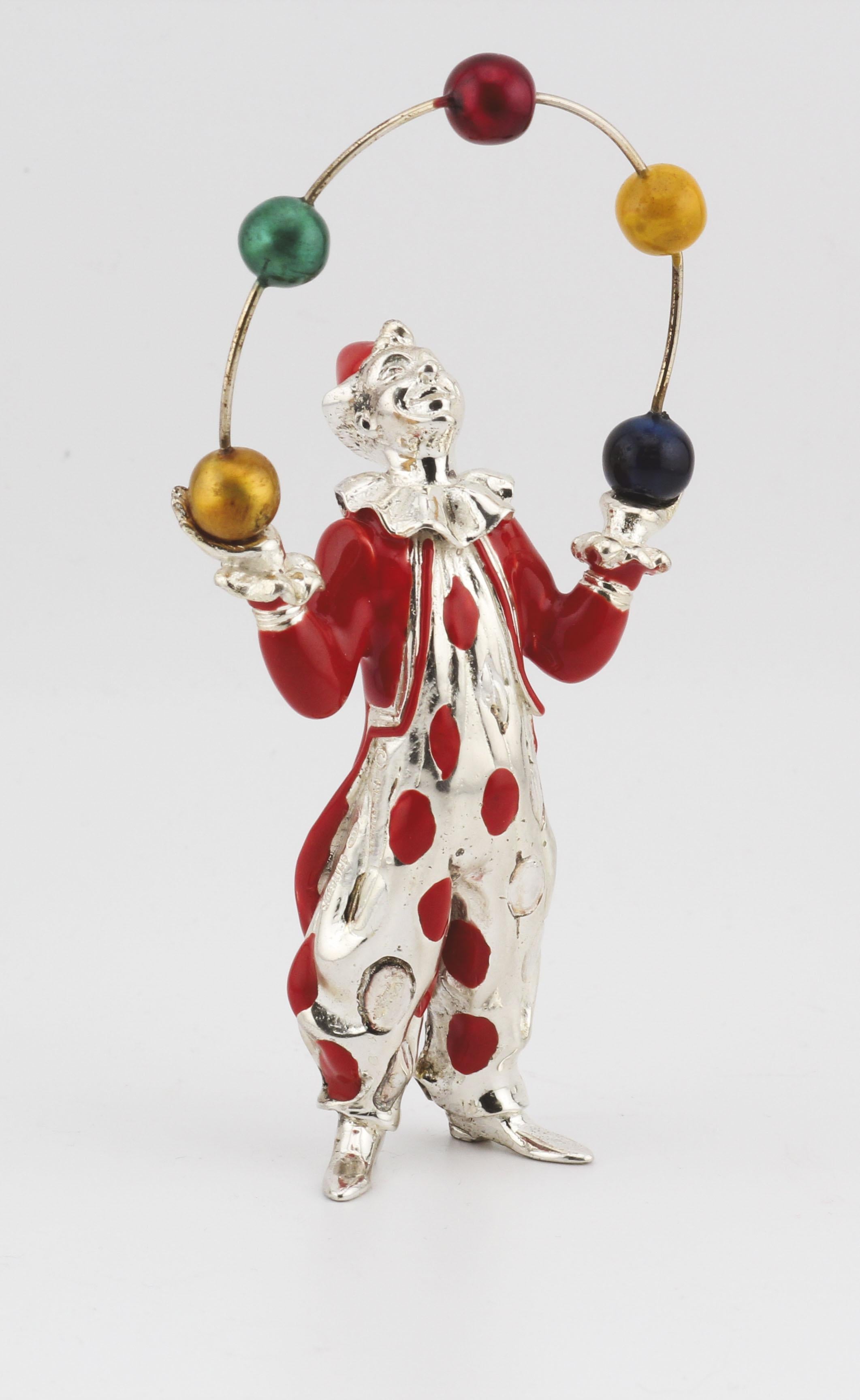 Bring a touch of whimsy and artistry to your collection with this sterling silver and enamel Juggling Circus Clown, designed by the legendary Gene Moore for Tiffany & Co. This delightful piece captures the joyful spirit of the circus with its