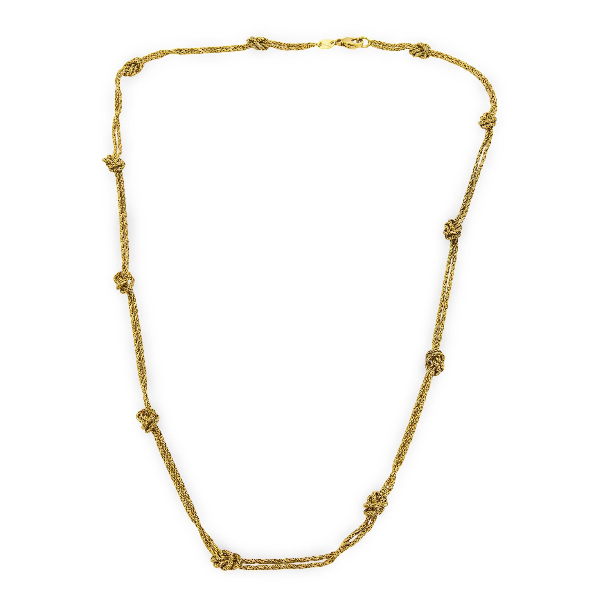 A fabulous and elegant Tiffany & Co. necklace! Crafted in 18k vibrant yellow gold this necklace is comprised of two rows of braided chain. Throughout the necklace, the two chains form 11 small knots, which add to the timeless look of the necklace.