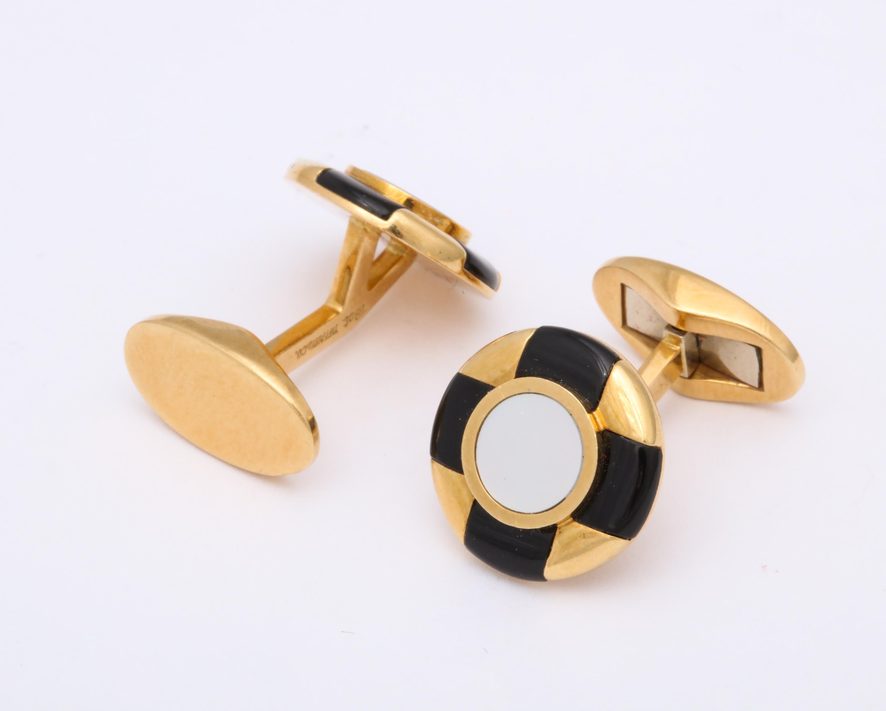 One Pair Of Gentlemans 18kt Gold Flip Up Cufflinks Designed With Mother Of Pearl Centers. Cufflinks Are Further Designed With Eight Custom Cut Onyx Panels. Cufflinks Are Created By Tiffany & Co. In The 1980's Made In Germany.