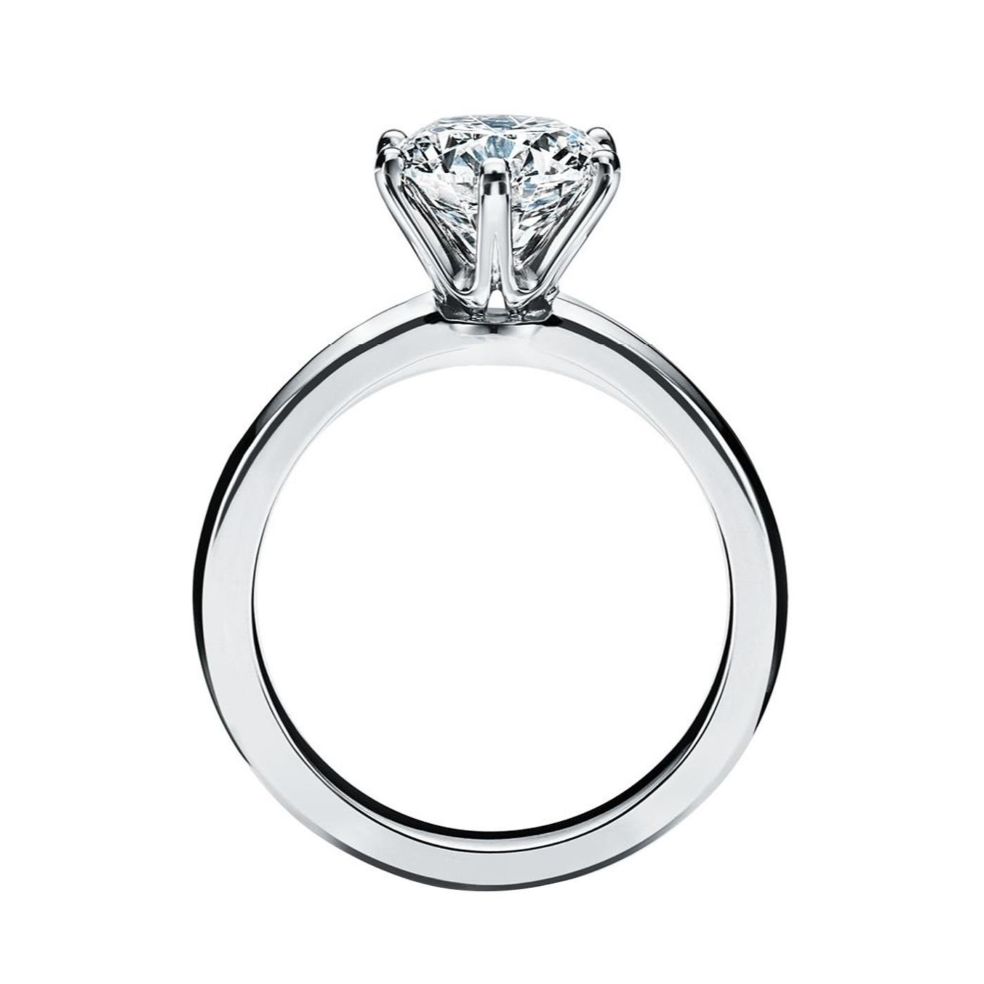 A true design masterpiece, the Tiffany Setting is the world’s most iconic engagement ring. Flawlessly engineered, the six-prong setting virtually disappears and allows the brilliant diamond to float above the band and into the light, resulting in a