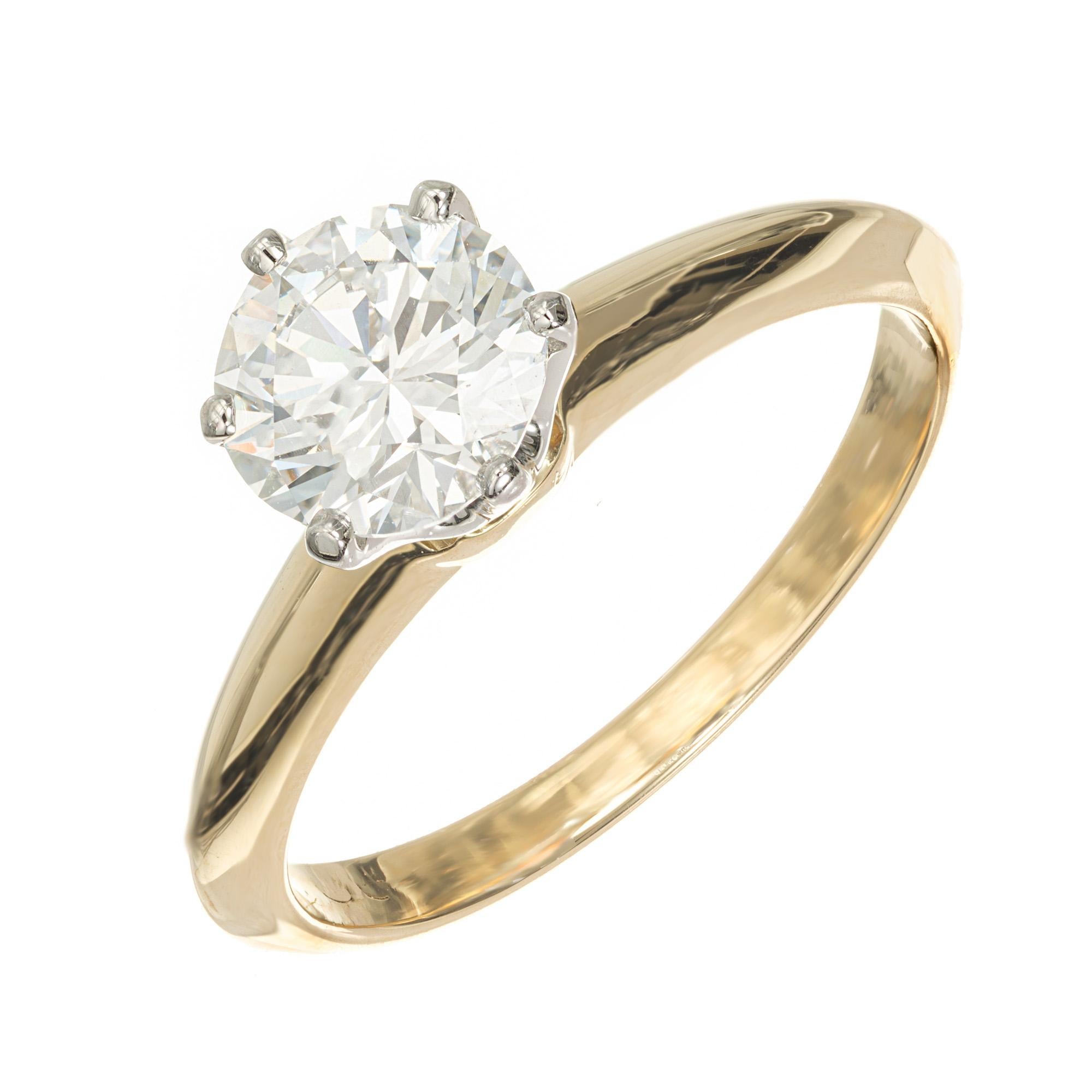 Vintage 1990's Tiffany & Co diamond solitaire engagement ring. GIA certified round brilliant center diamond in a platinum six prong crown on top of an 18k yellow gold setting. GIA certified as F (colorless) and VS2. In the 1990's time period,