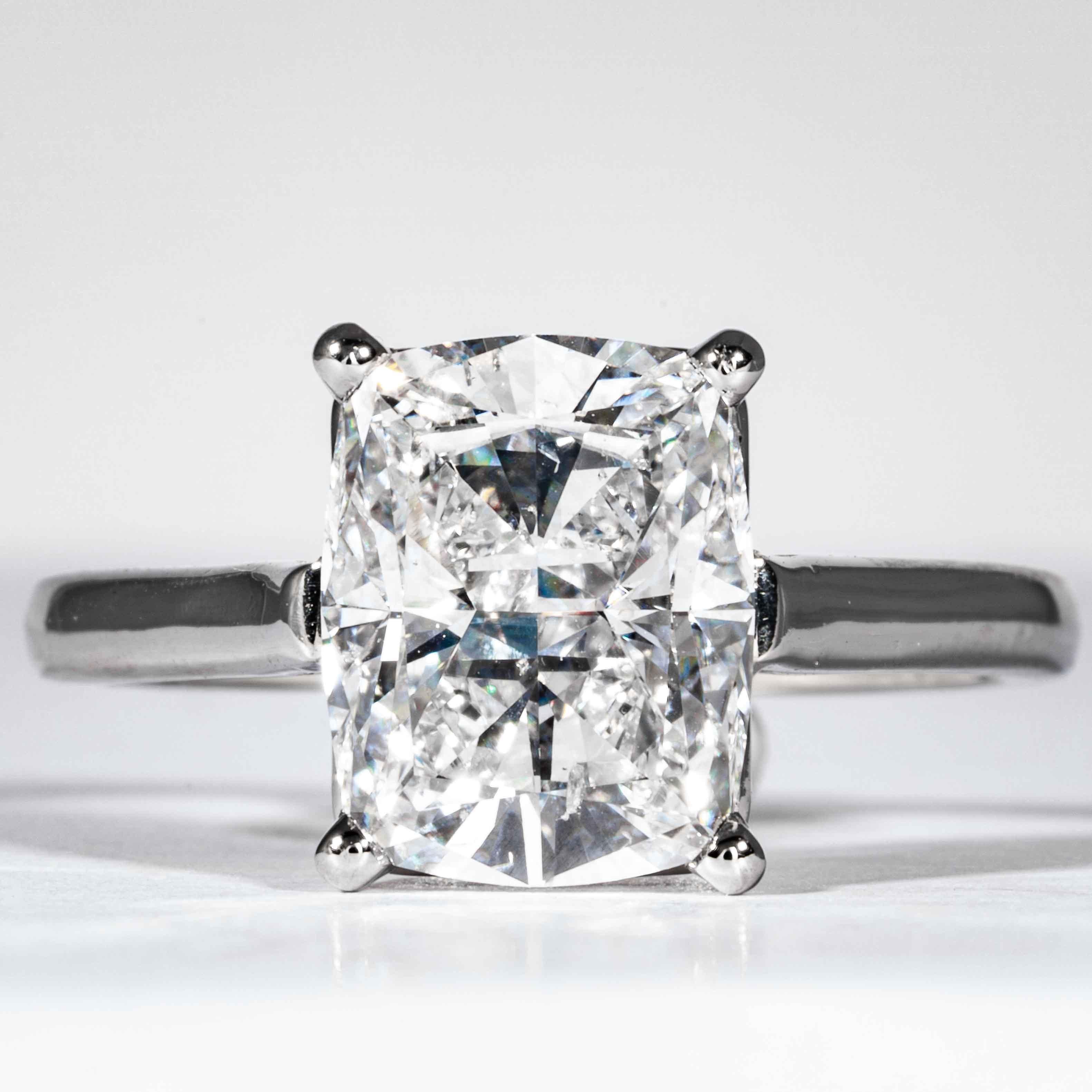 This diamond ring is offered by Shreve, Crump & Low. This 3.05 carat GIA Certified D SI1 cushion cut diamond measuring 10.07 x 7.92 x 5.20 mm is custom set in a handcrafted platinum solitaire ring, signed Tiffany & Co. The 3.05 carat cushion cut is